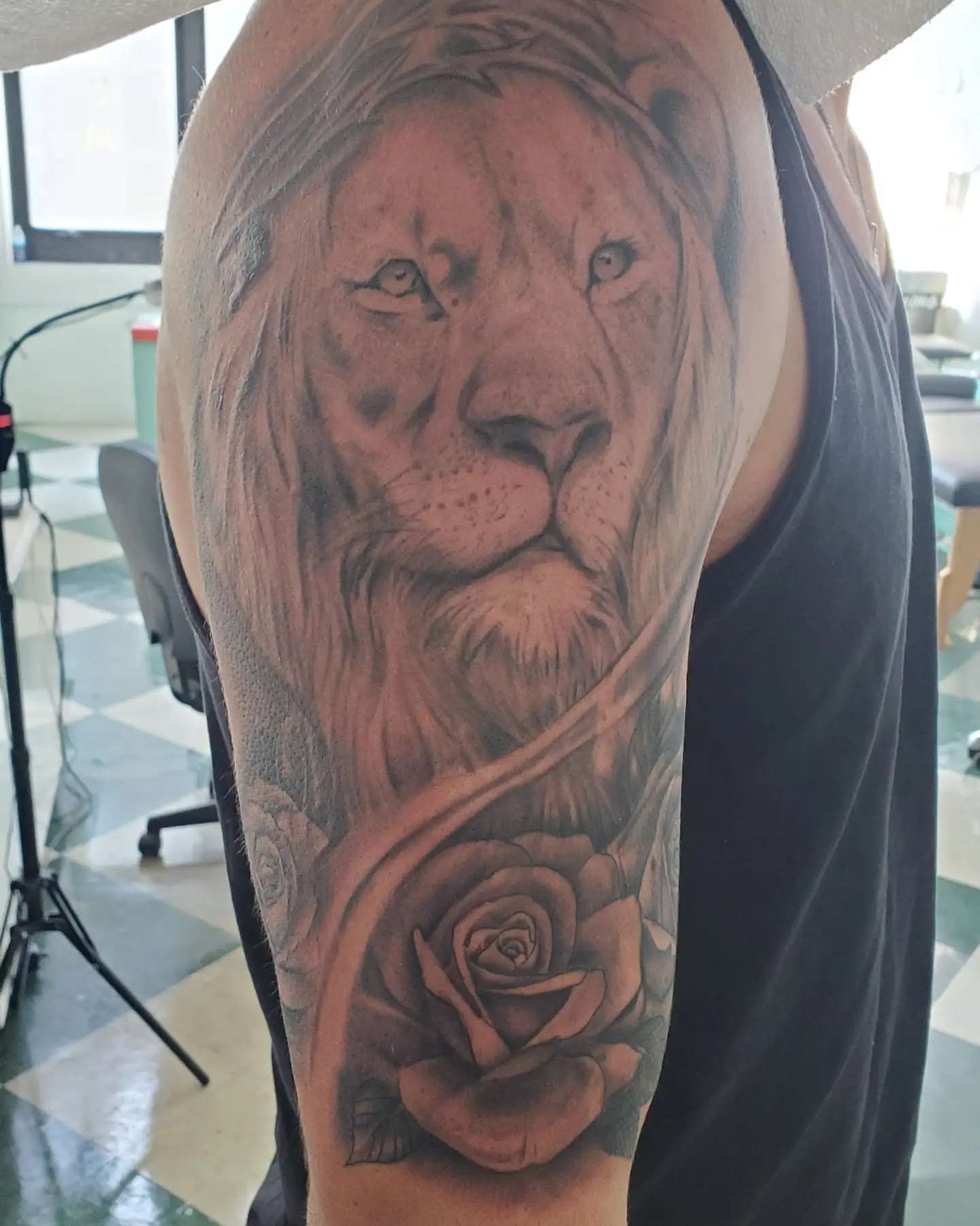 Lion and rose realism tattoo on the forearm by David Nash, Evansville, Indiana