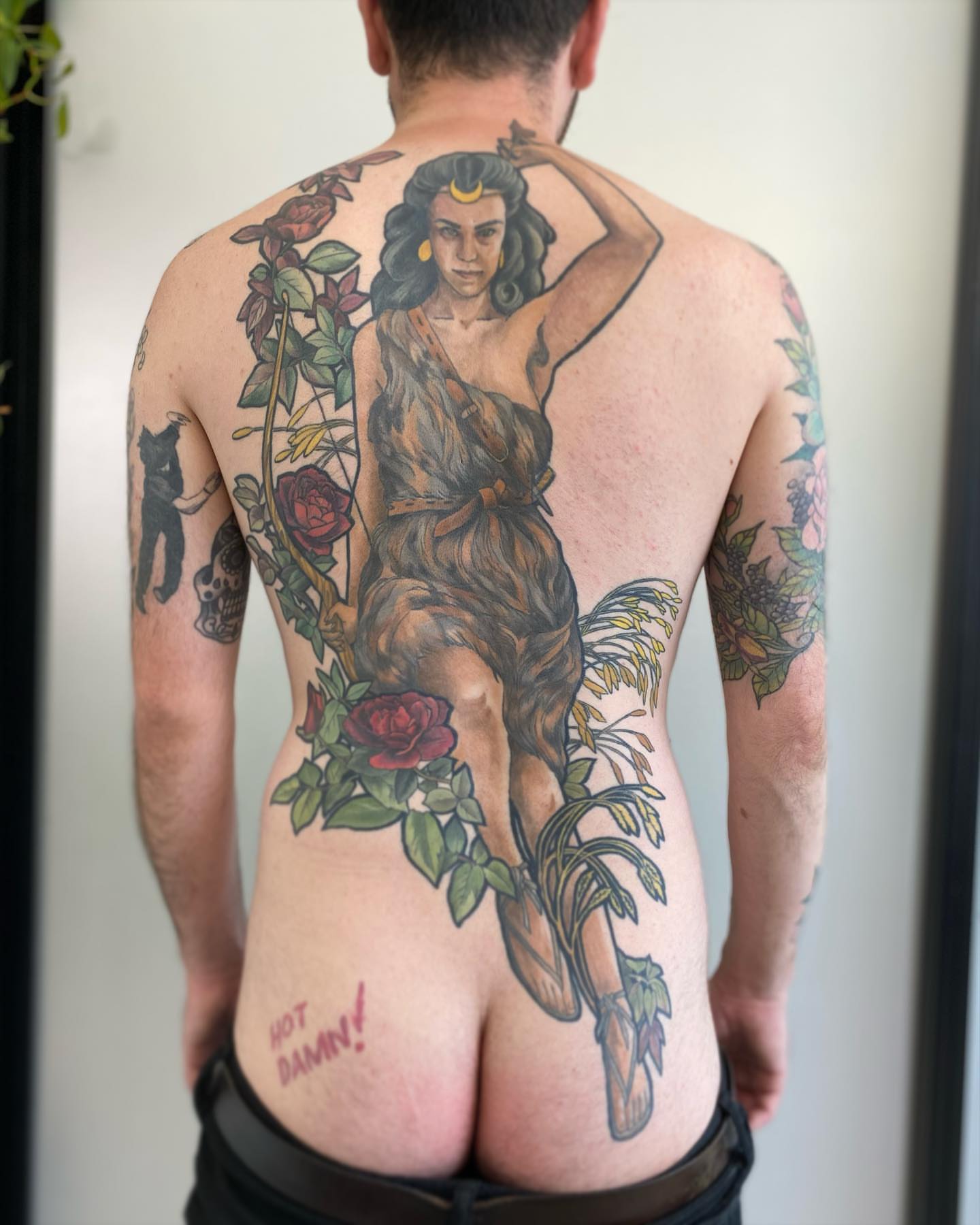 Woman with roses American traditional tattoo on the back by Rusty Indigo