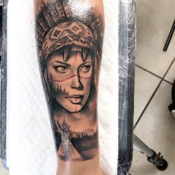 Woman with headdress realism tattoo on the forearm by Angel Perez