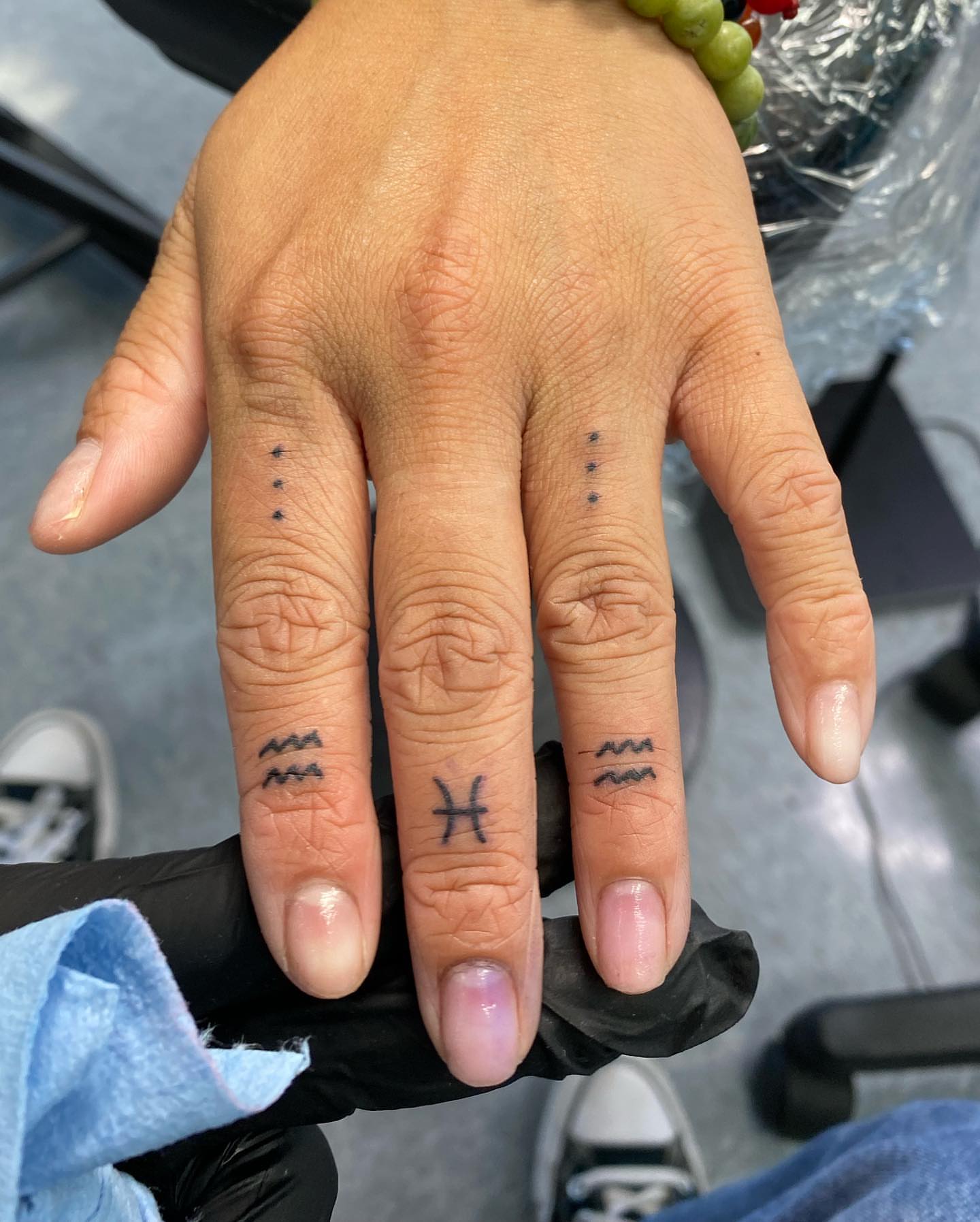 Zodiac symbols dotwork tattoo on the hand by Steph π€