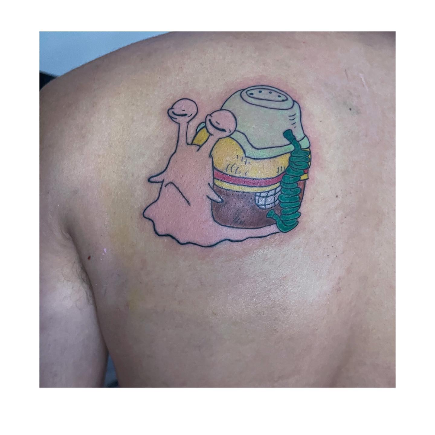 Snail with telephone new school tattoo on the back by Shampooh