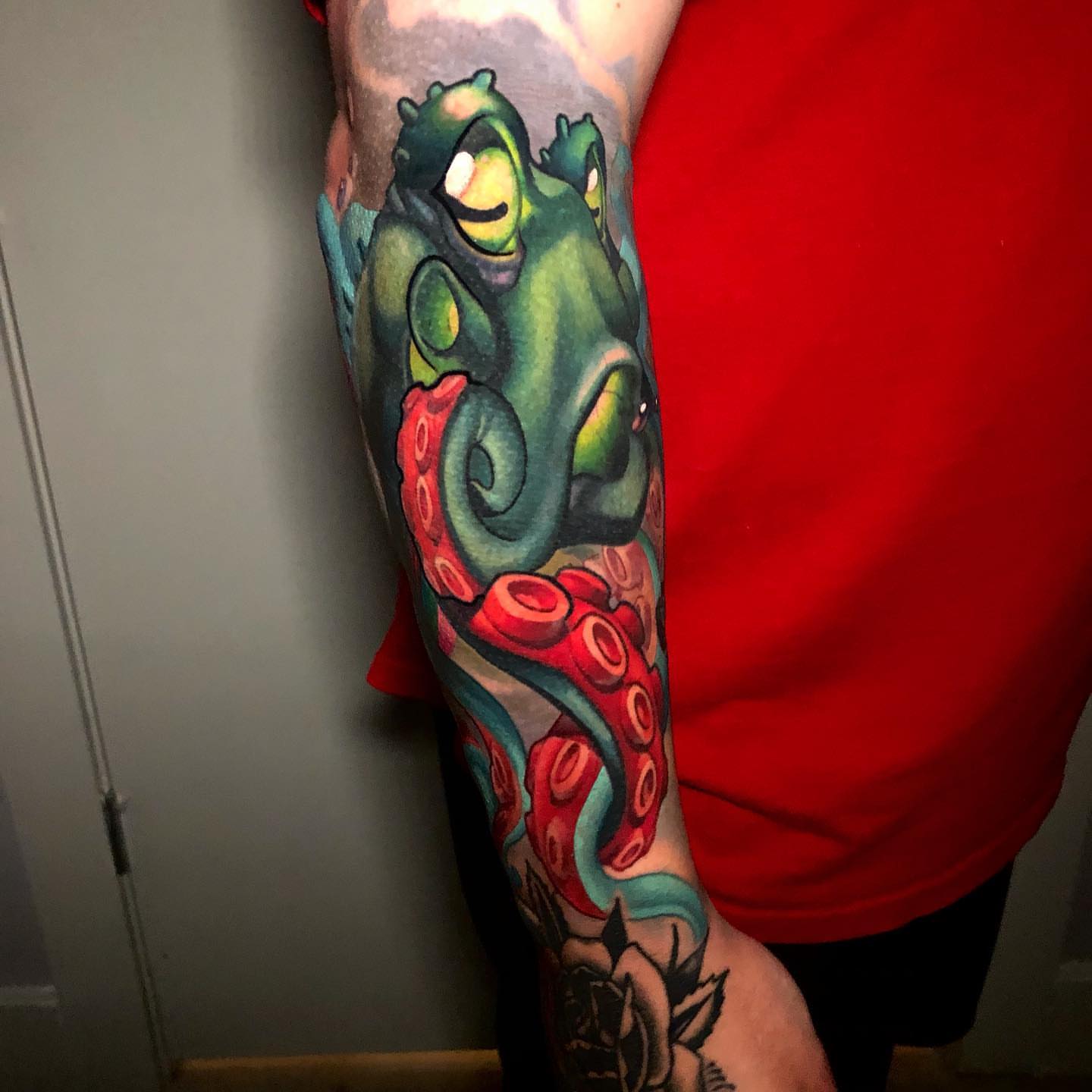 Octopus American traditional tattoo on the forearm by Tim Stafford