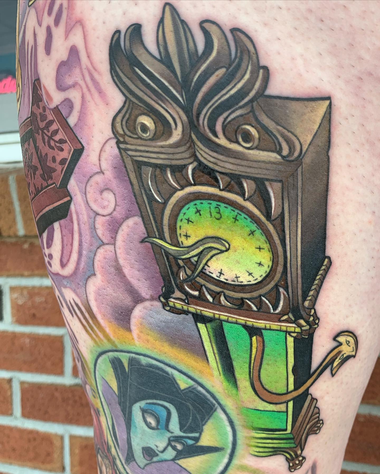 Clock with dragon American traditional tattoo on the forearm by Ariel Robinson