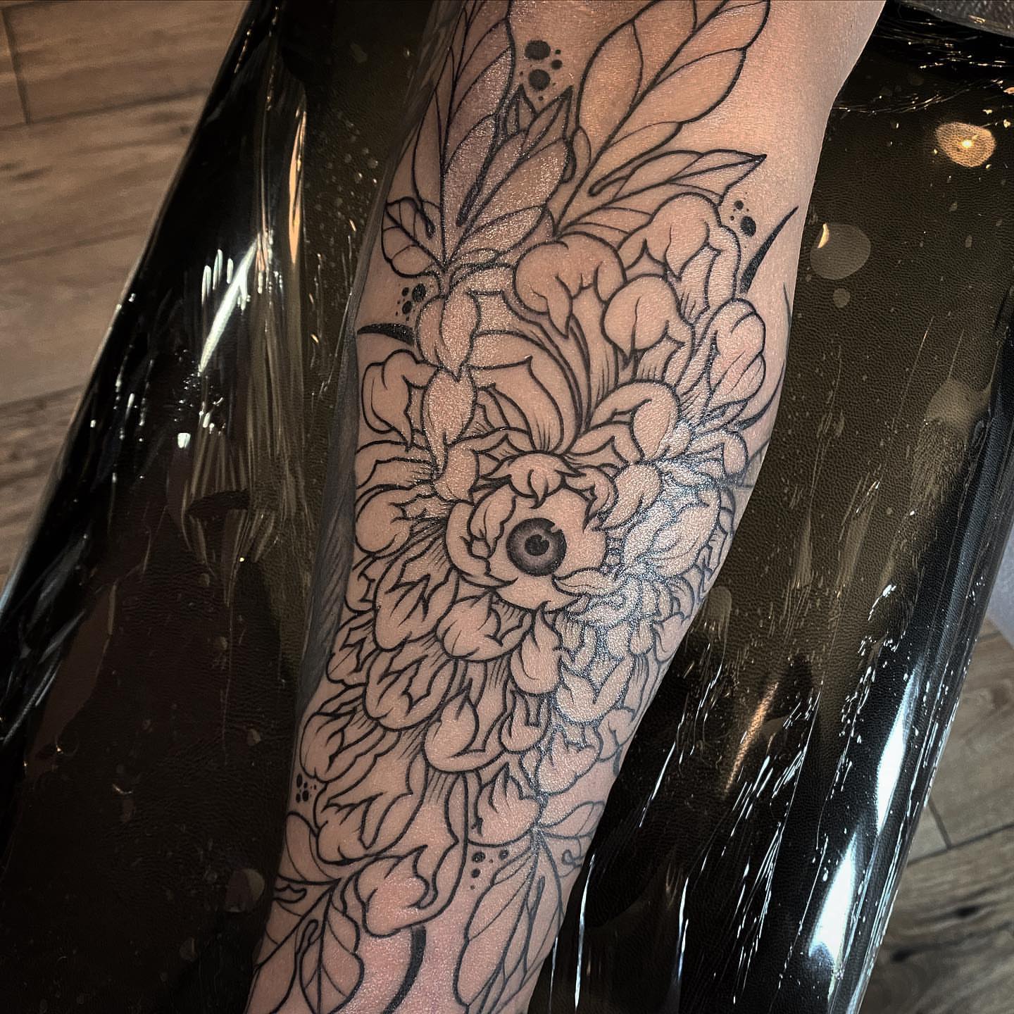 Floral bouquet black and grey tattoo on the forearm by ⠀⠀ ⠀ ⠀ ⠀⠀ ⠀⠀ ⠀⠀ ⠀ ⠀⠀ ⠀⠀ᎪᎳᏃ, West Hollywood, California