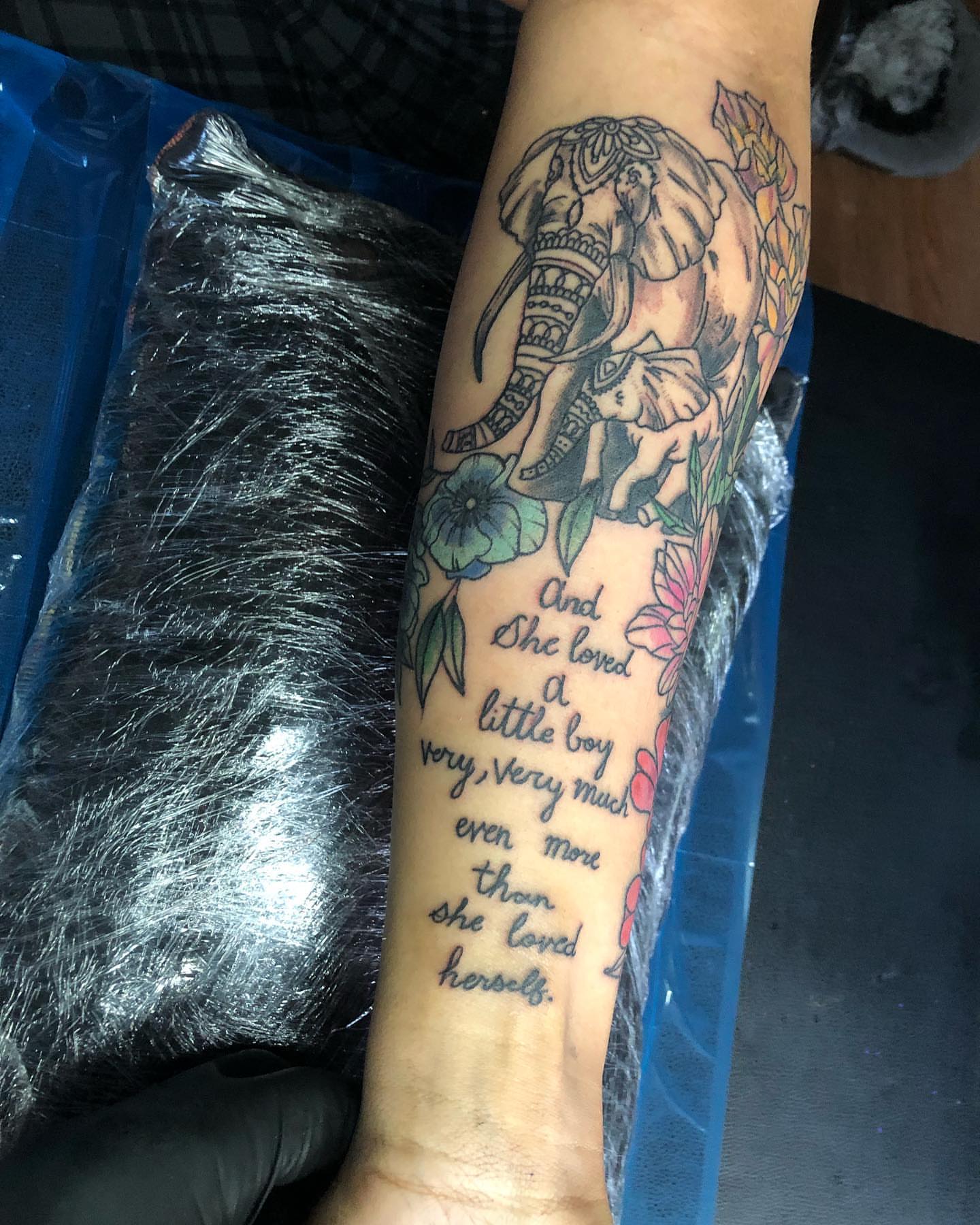 Elephant and floral American traditional tattoo on the forearm by Dre Inks
