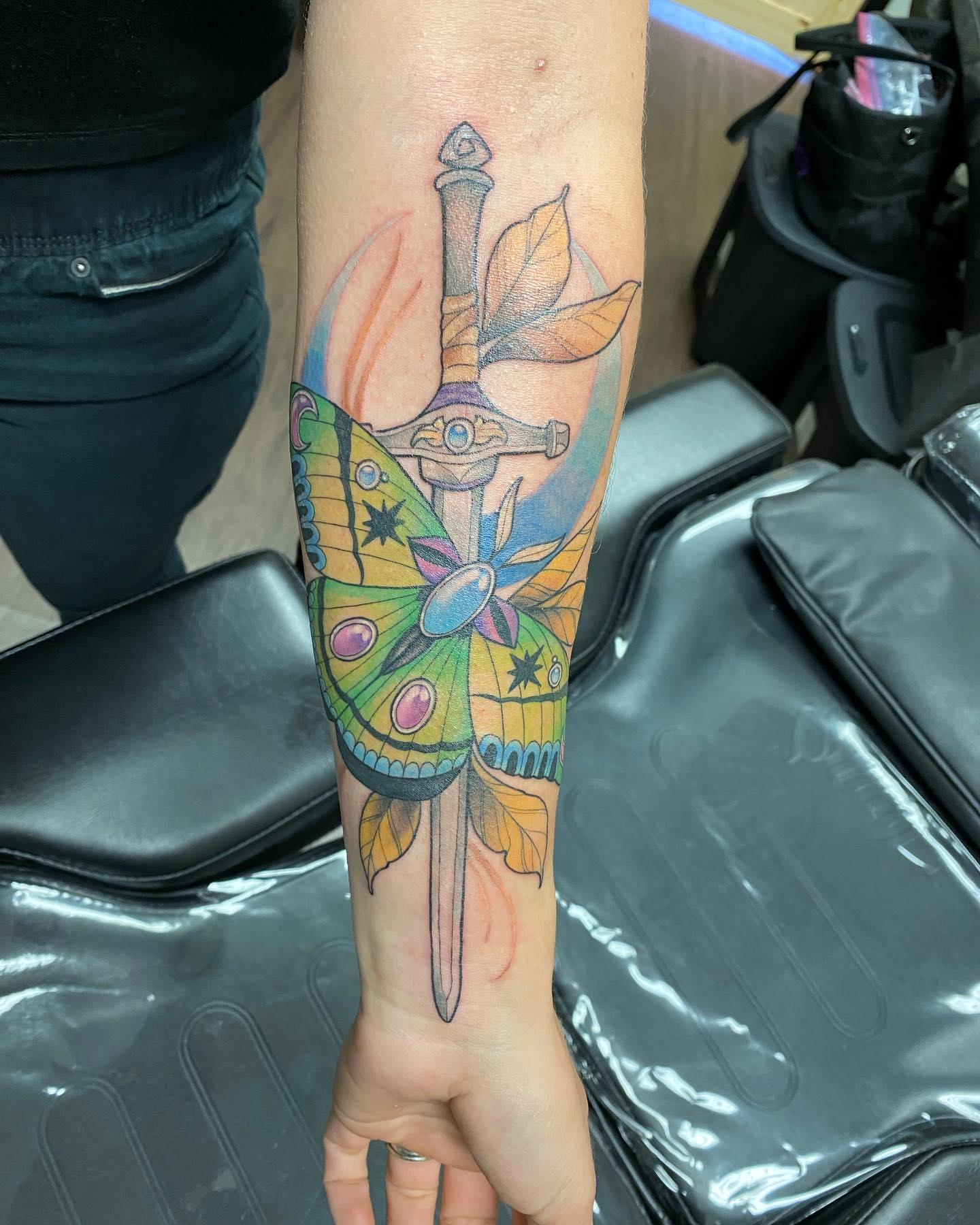 Butterfly and sword new school tattoo on the forearm by Valen Laska
