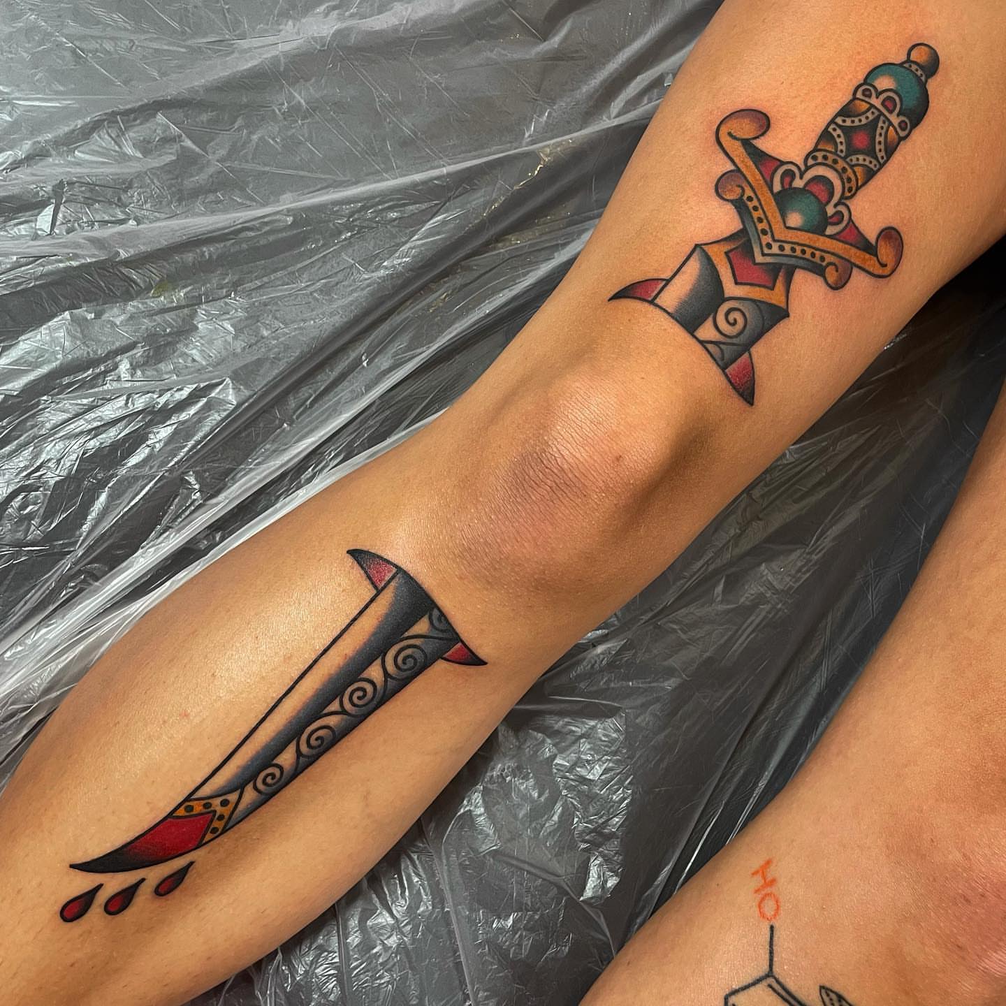 Swords American traditional tattoo on the forearm by Rogelio Robles