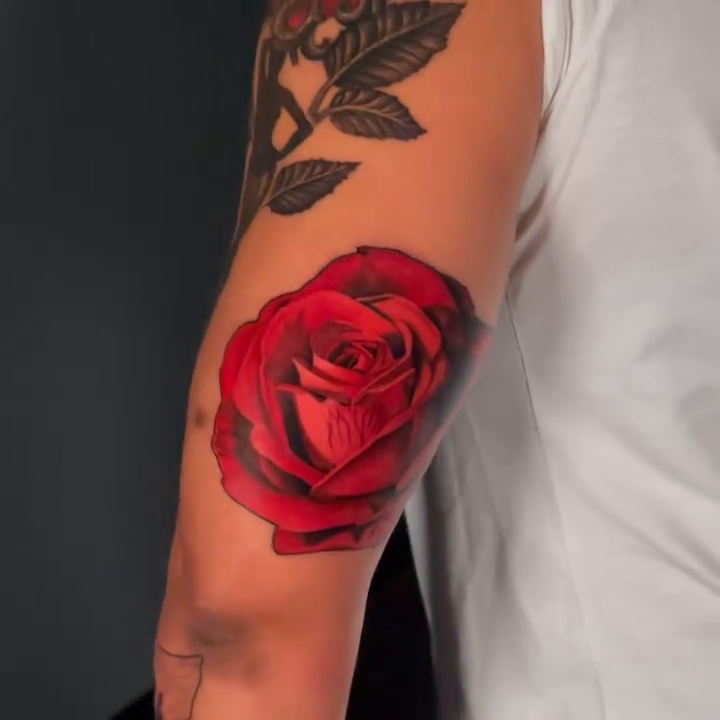 Rose realism tattoo by Travis Chick