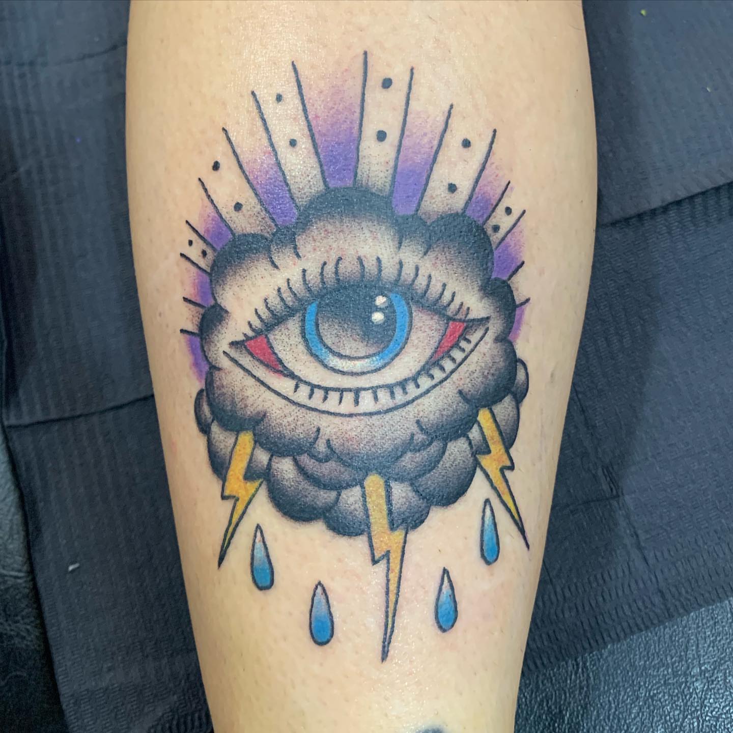 Eye cloud American traditional tattoo on the forearm by IdleHandsFlex, New Orleans, Louisiana