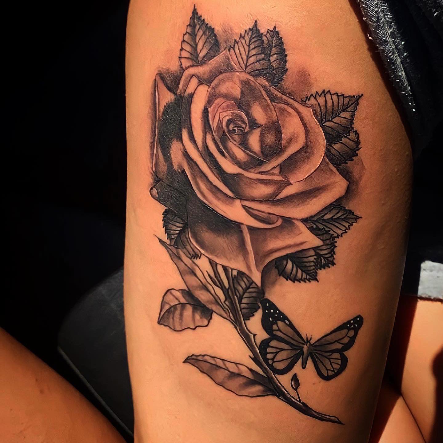 Rose and butterfly realism tattoo on the thigh by Immortal BAYAREA TATTOO ARTIST
