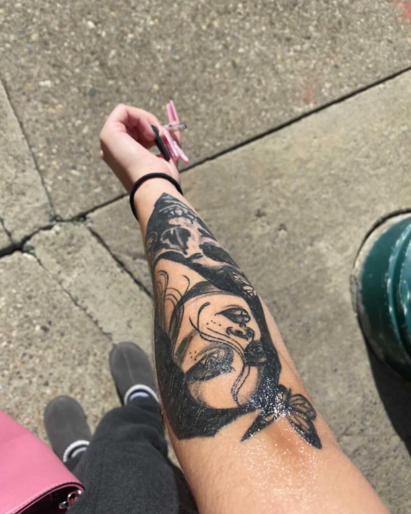 Woman black and grey tattoo on the forearm by Dre Inks