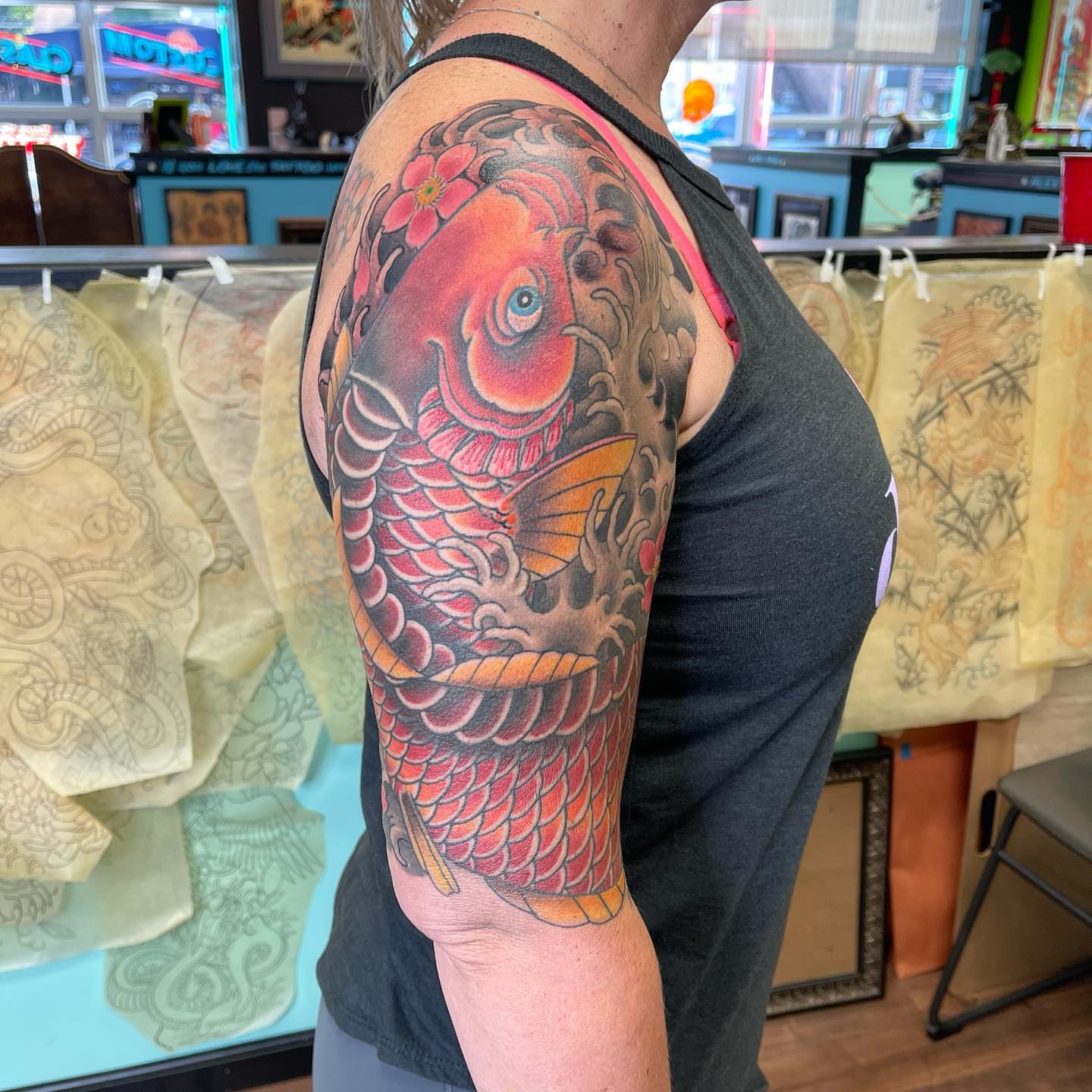 Koi fish japanese irezumi tattoo on the upper arm by Mark Thompson, Dallas, Texas