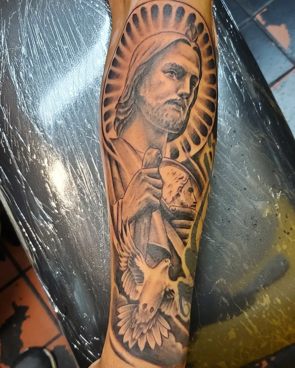 Religious figure realism tattoo on the forearm by David Xavier Jimenez