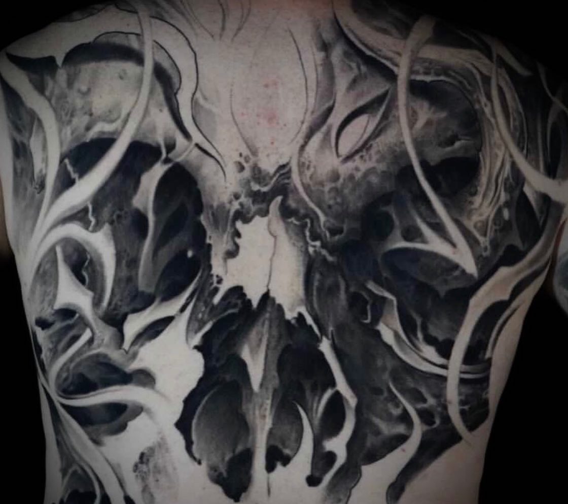 Abstract flame dark realism tattoo on the chest by Victor Portugal Tattoo