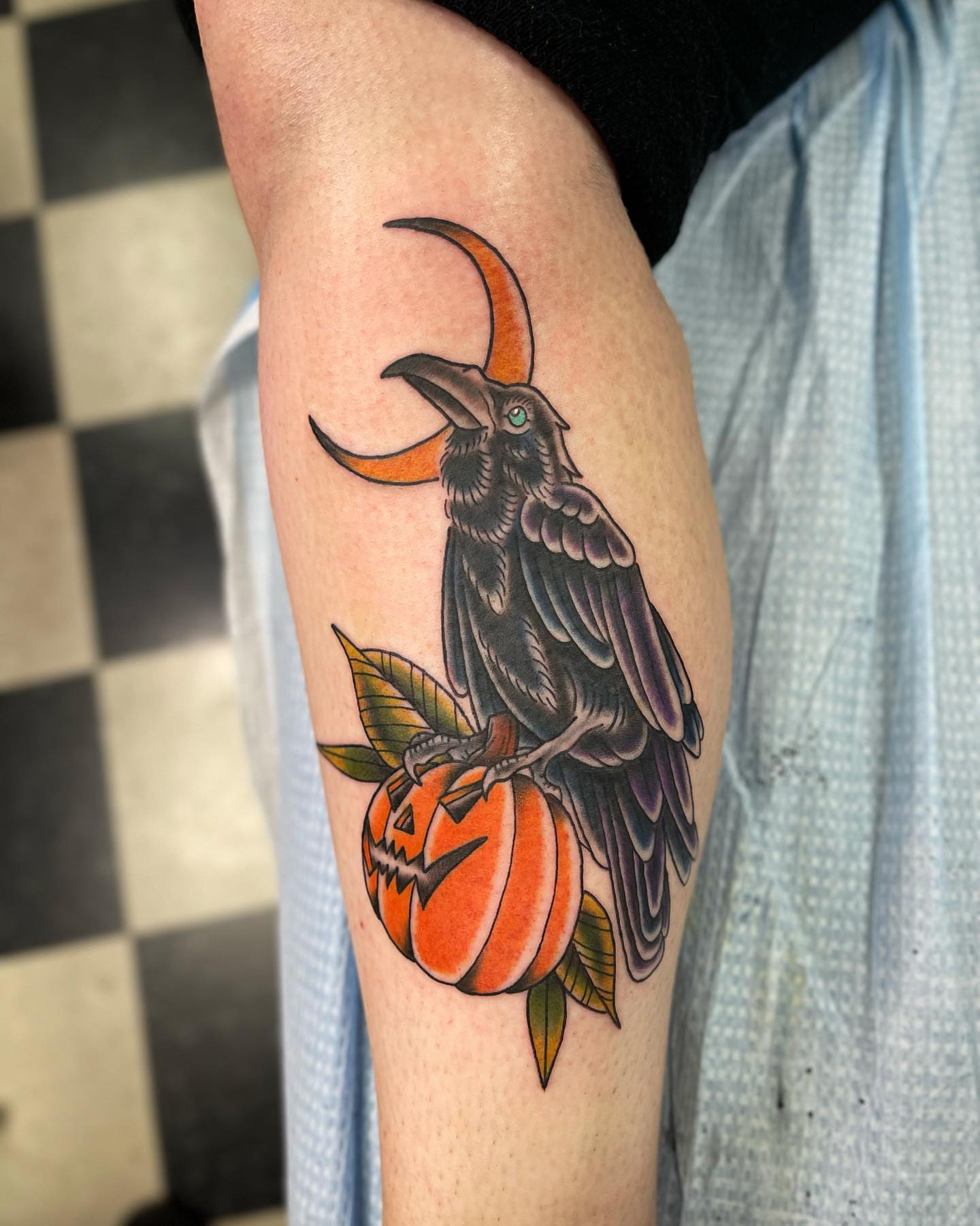 Raven and pumpkin American traditional tattoo on the forearm by Jake Snoddy, Franklin, Tennessee