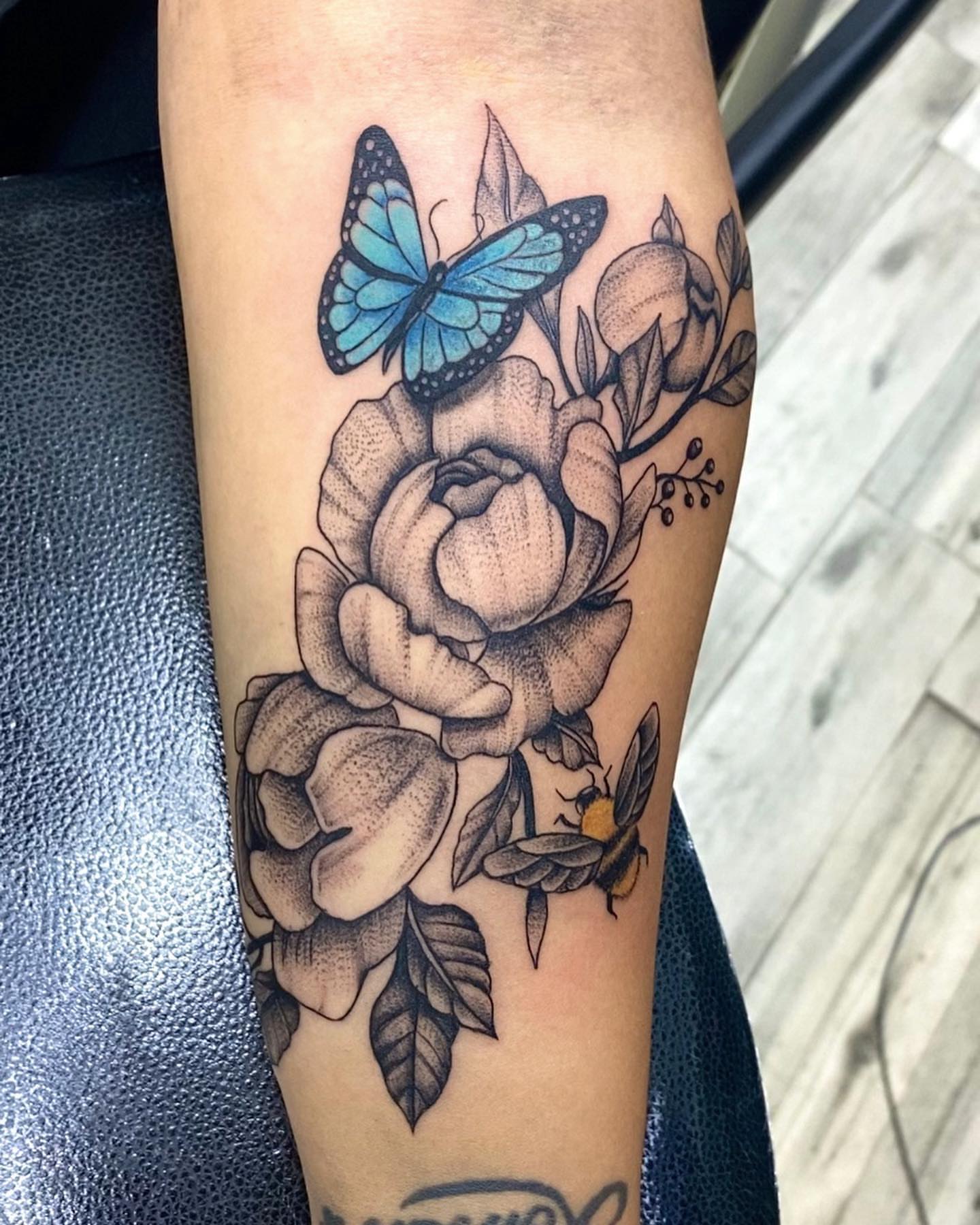 Peony and butterfly dotwork tattoo on the forearm by Monique Ortiz, Mesa, Arizona