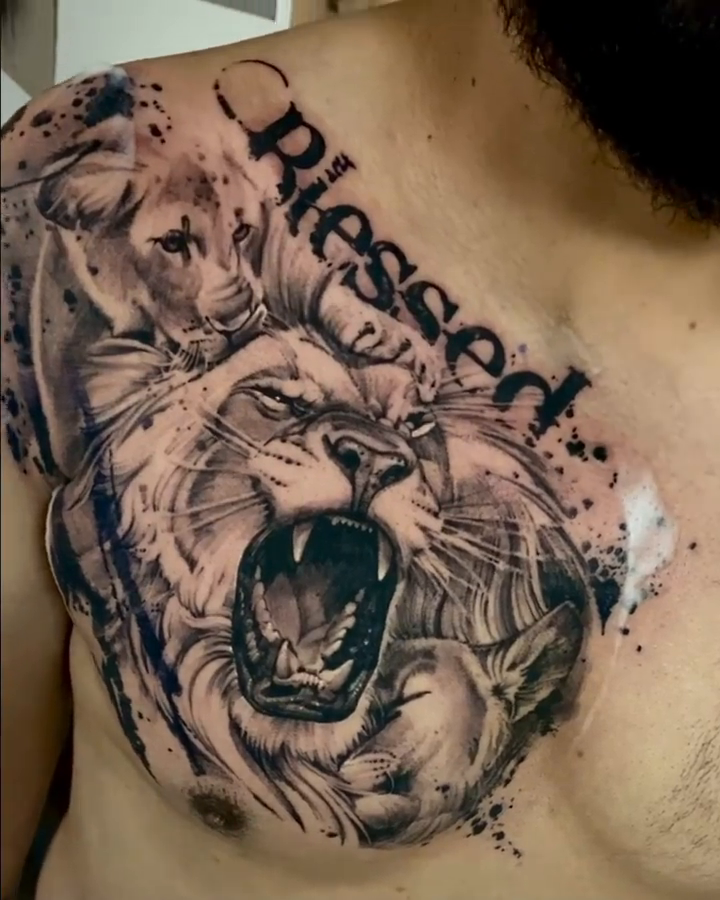 Lion and cubs with religious text Chicano tattoo on the chest by David Garner, Los Angeles, California
