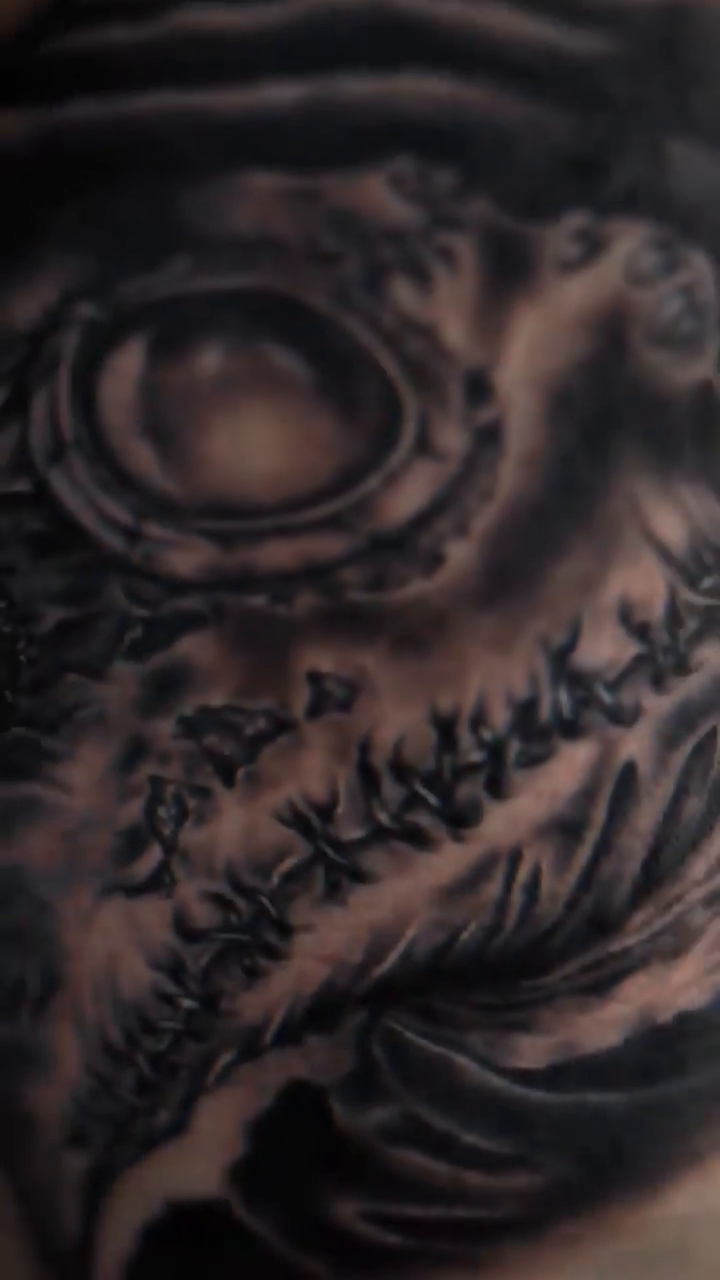Tattoo by @gustavo.bulldogtattoo — dark_realism, black_and_grey
