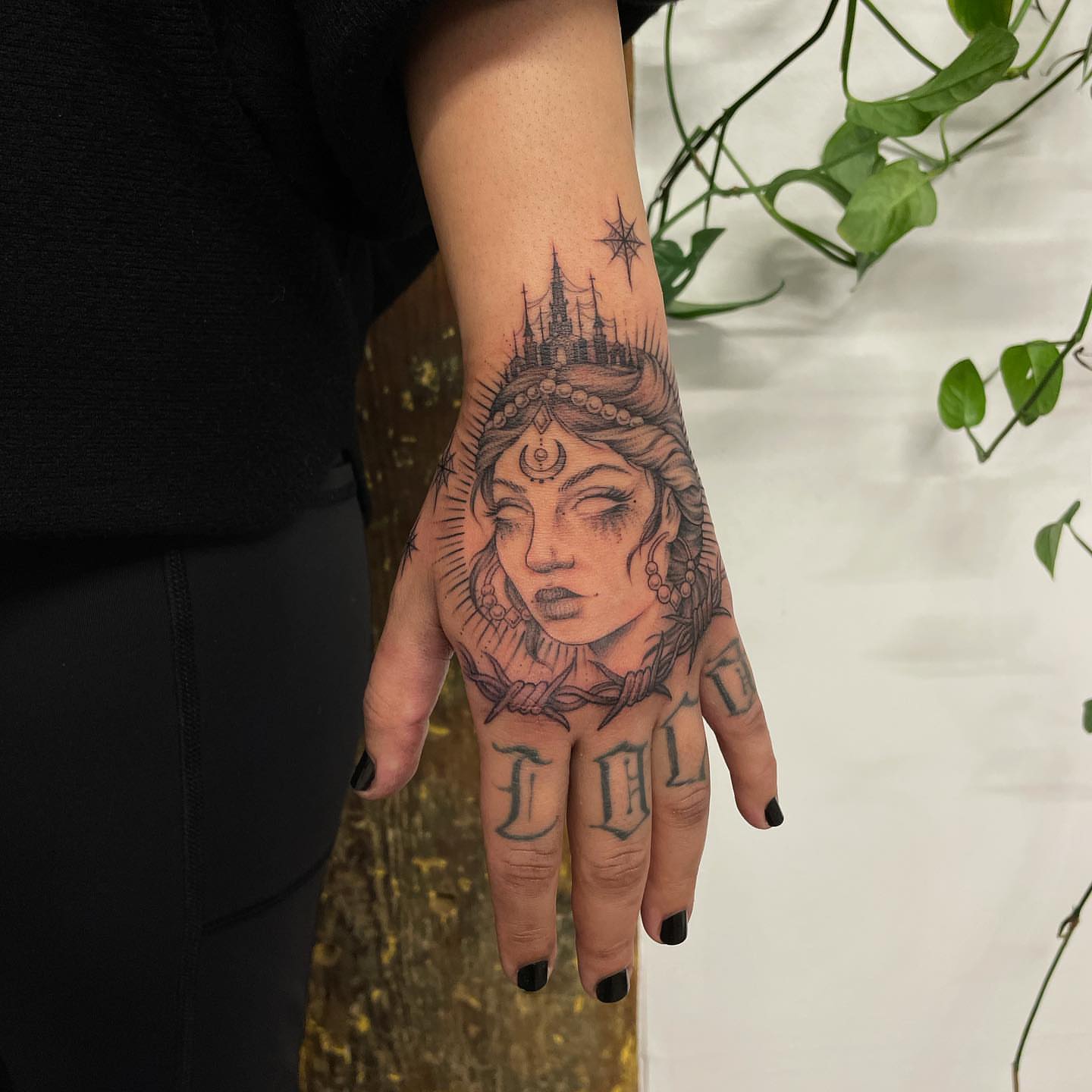 Woman's face realism tattoo on the hand by @jettaturas, New City, New York