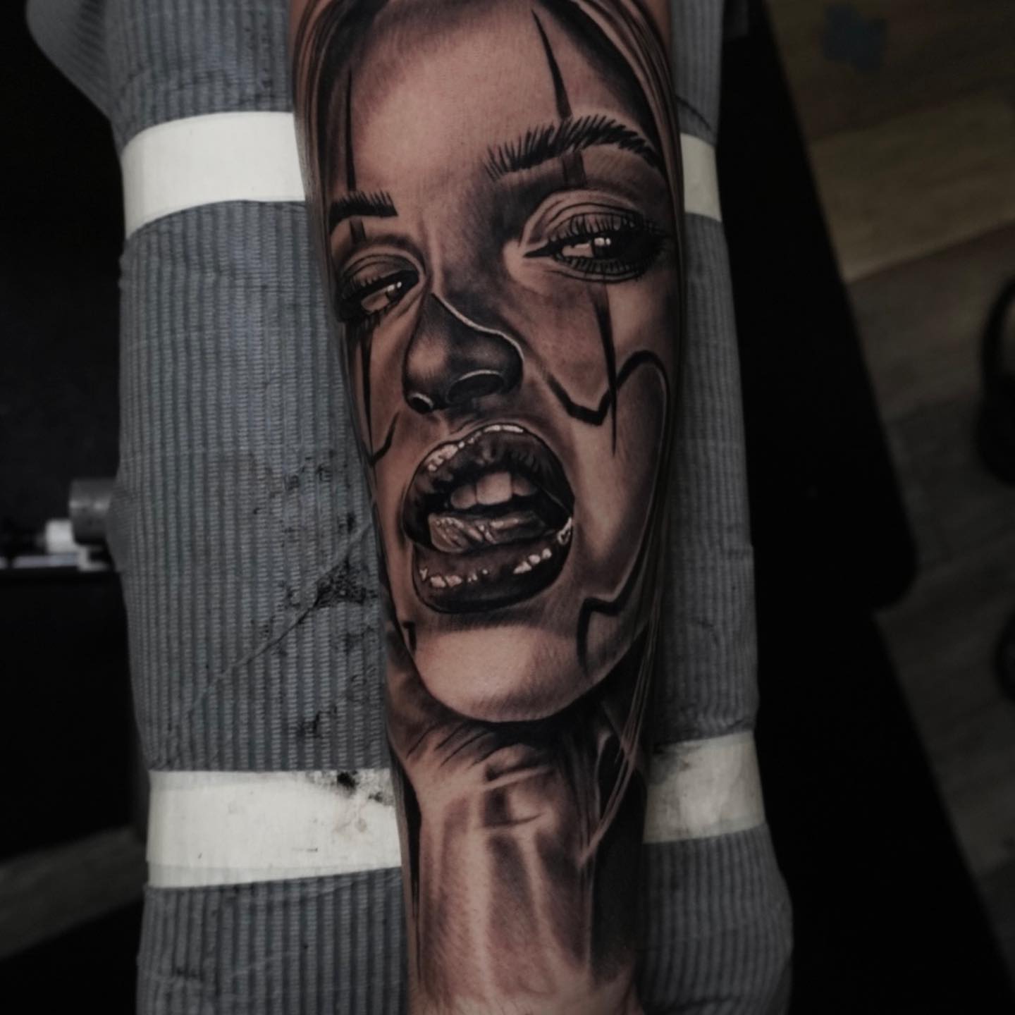 Woman's face realism tattoo on the forearm by Brian Cassidy