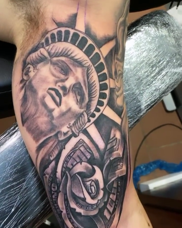 Statue of Liberty and rose realism tattoo by Breyner, Cambridge, Massachusetts