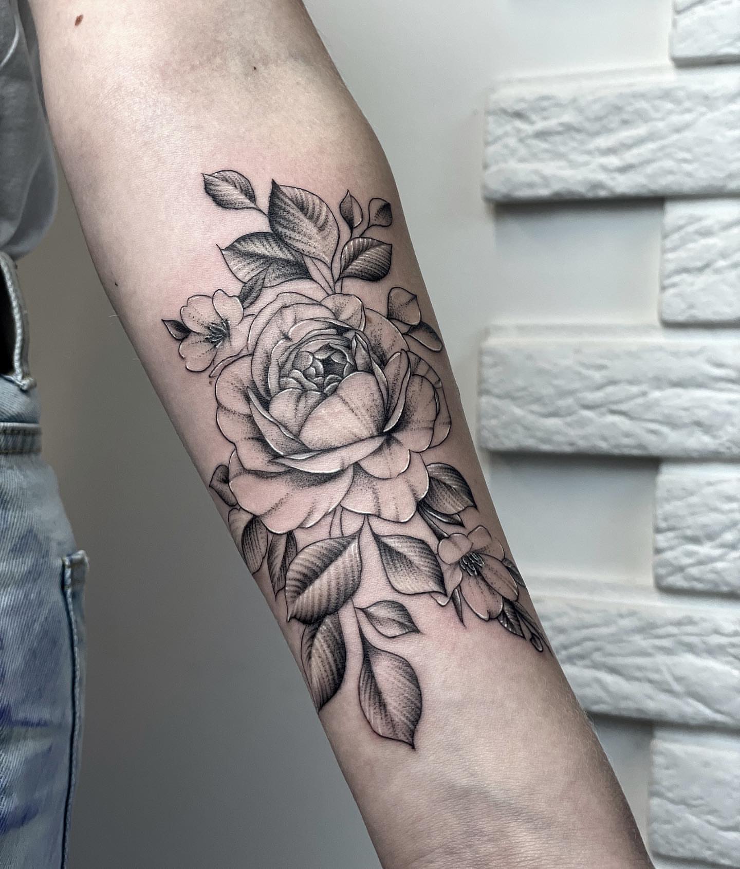 Roses black and grey tattoo on the forearm by Annie Overchuk