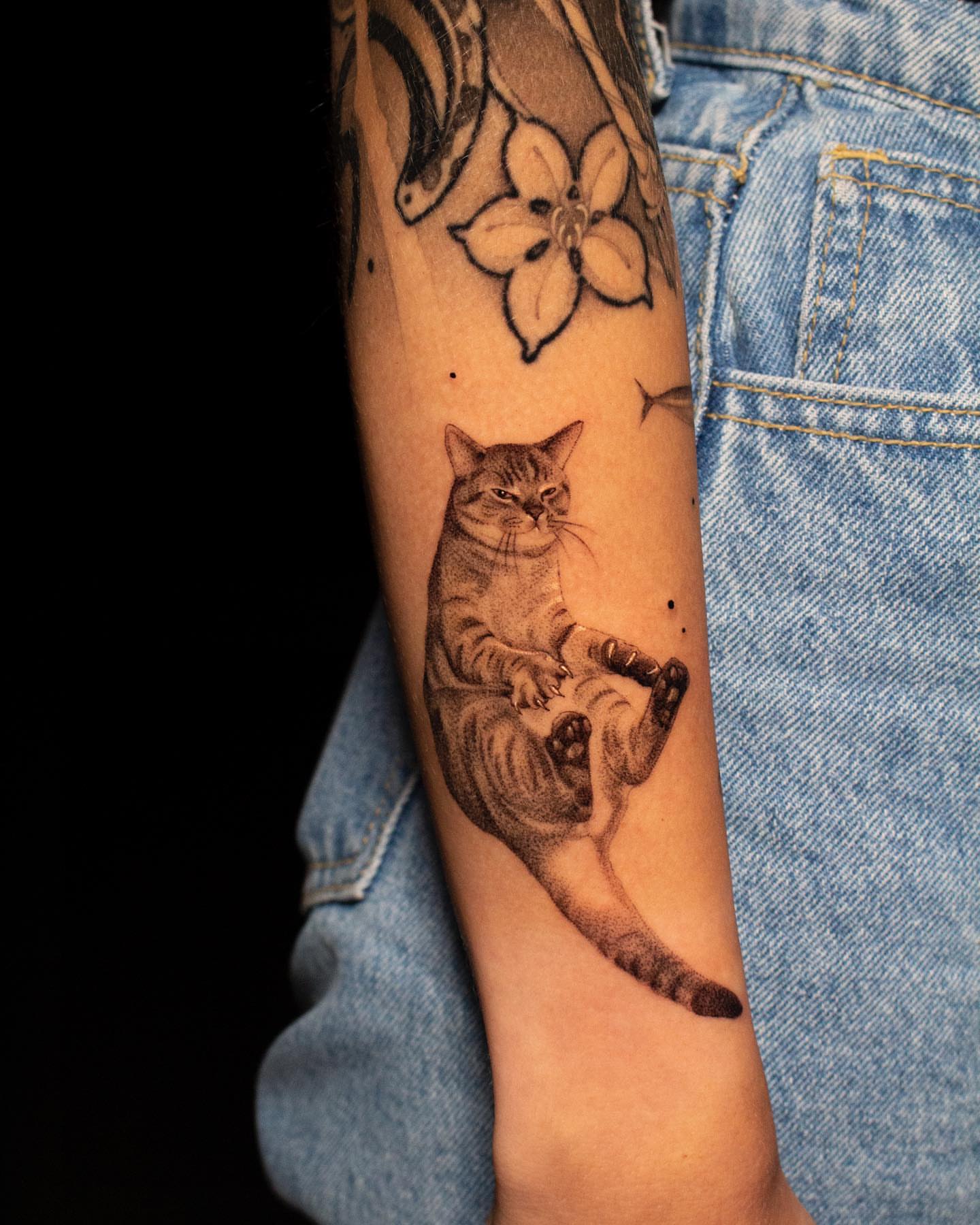 Cat realism tattoo on the forearm by Nikita Grinenko, San Francisco