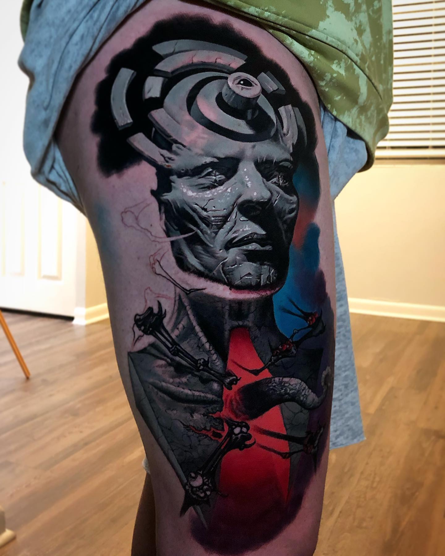 Man with mechanical head dark realism tattoo on the thigh by Jacob Sheffield, Grand Junction, Colorado