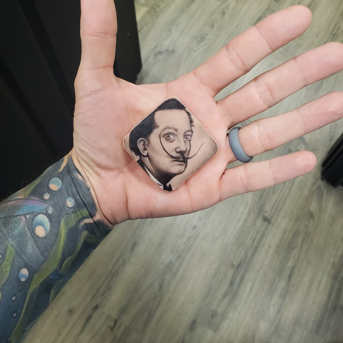 Salvador dali realism tattoo on the hand by @stevison15