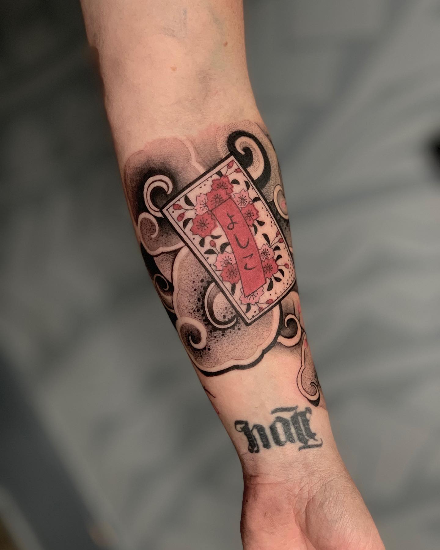 Card with floral design dotwork tattoo on the forearm by 🇵🇭Mark Gaño