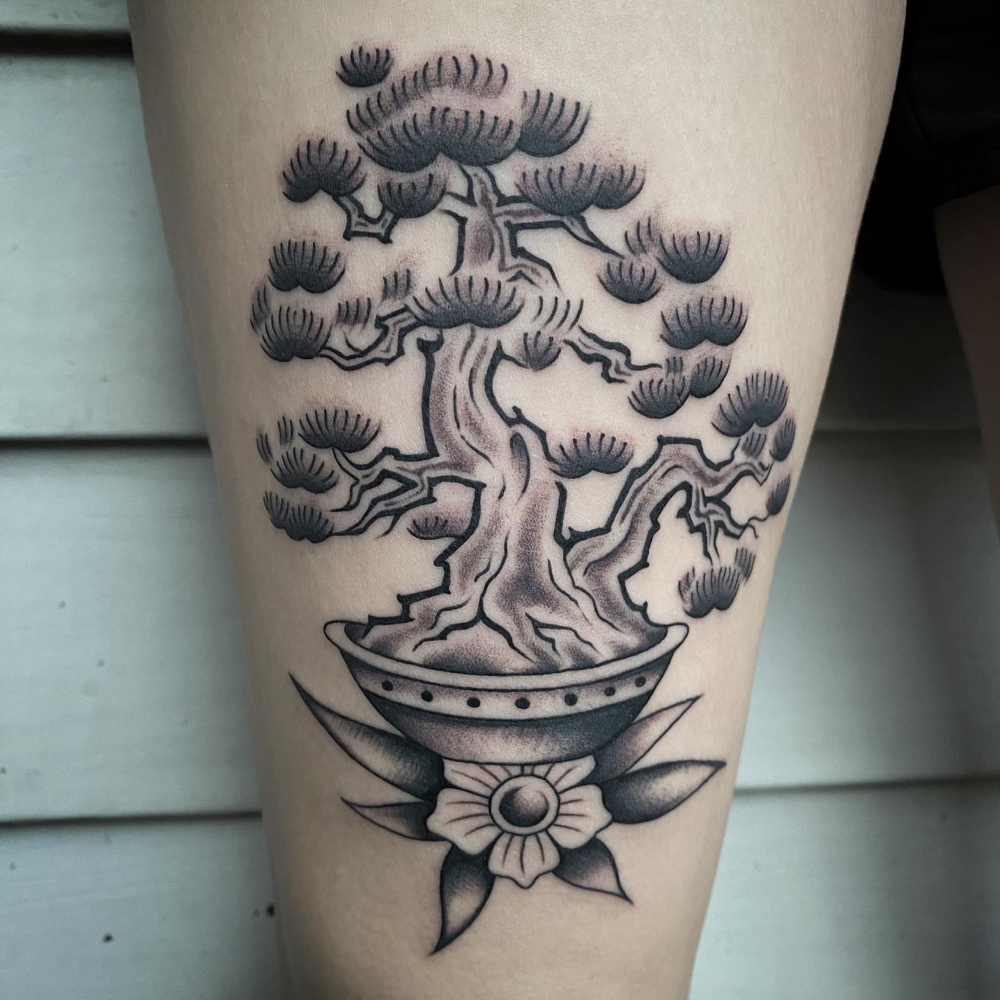 Bonsai tree realism tattoo on the thigh by Daniel Mesen