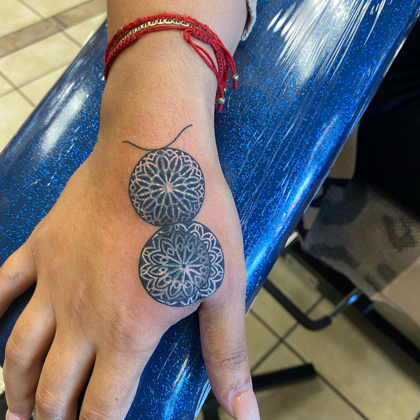 Mandala dotwork tattoo on the hand by Nicholas Jones