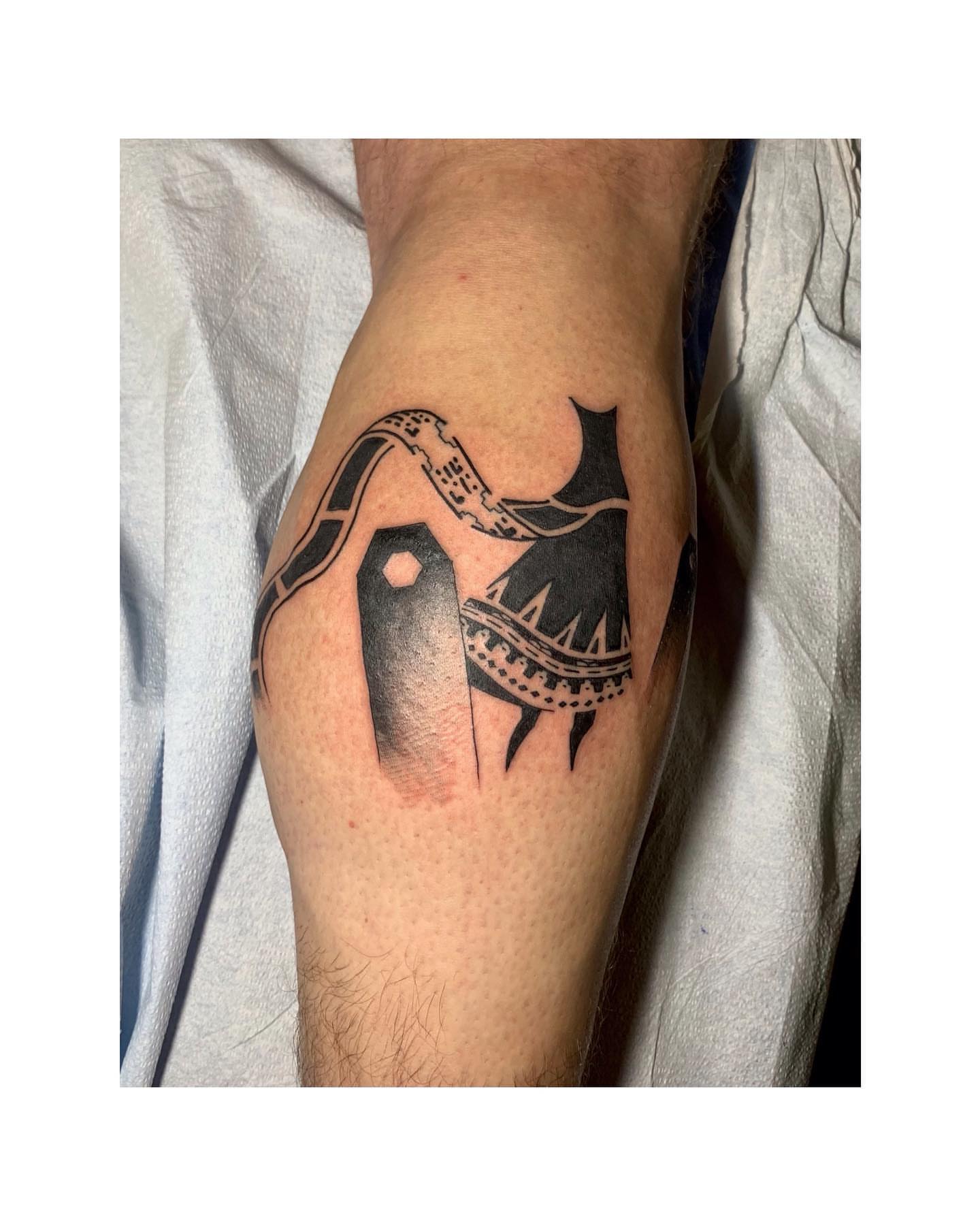 Boat and waves black and grey tattoo on the forearm by Shamanic Ink