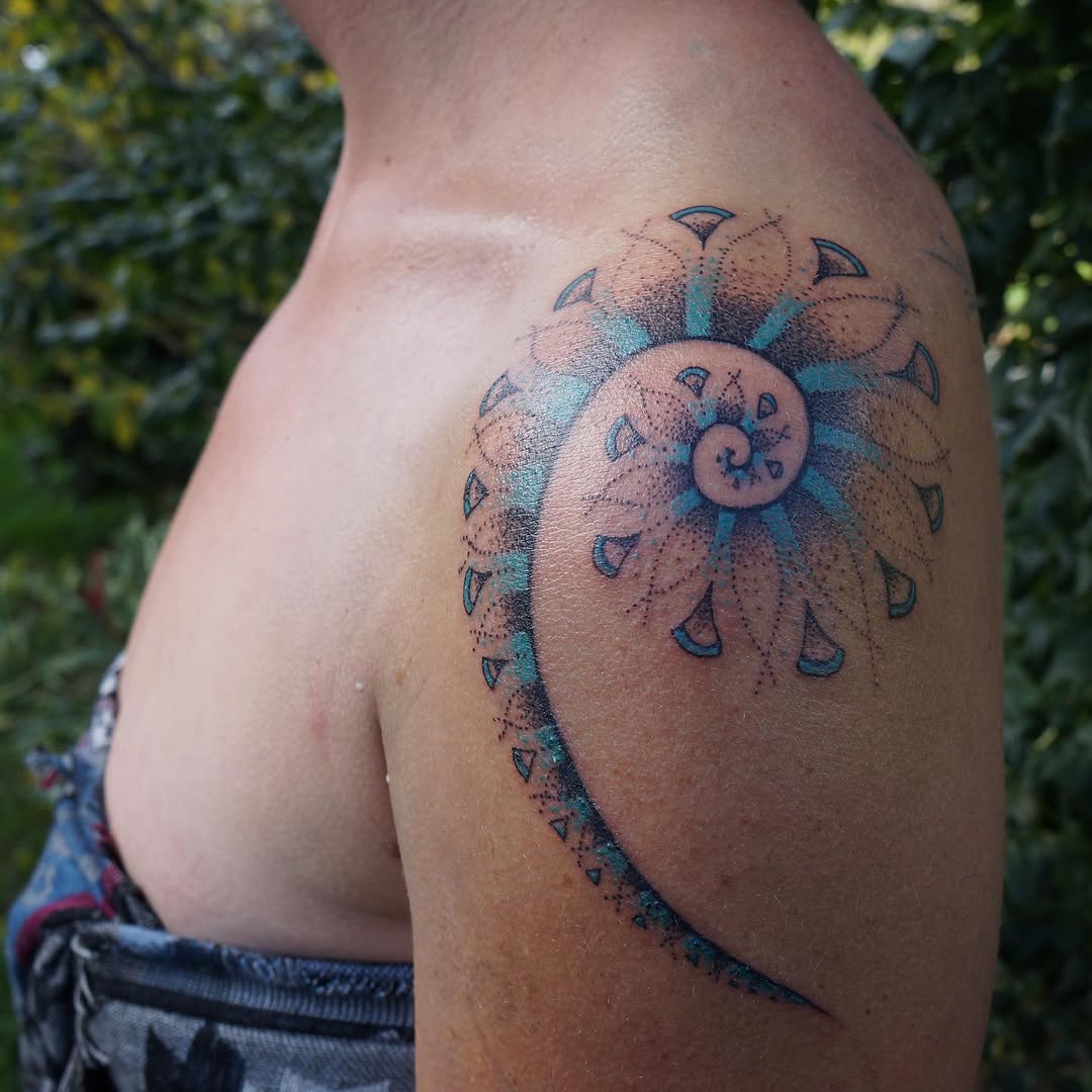 Spiral mandala dotwork tattoo on the shoulder by La Main Bleue