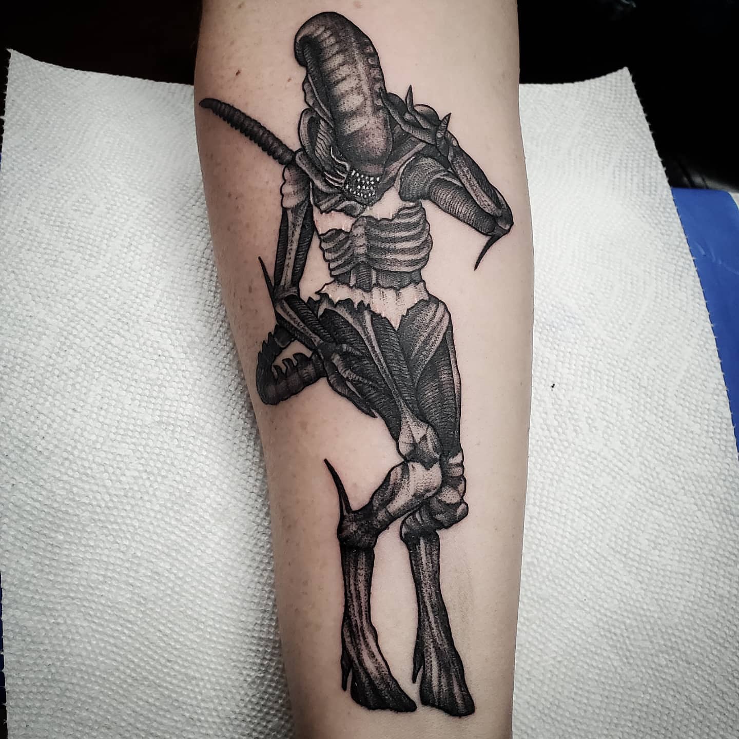 Alien creature realism tattoo on the forearm by Kyle Black