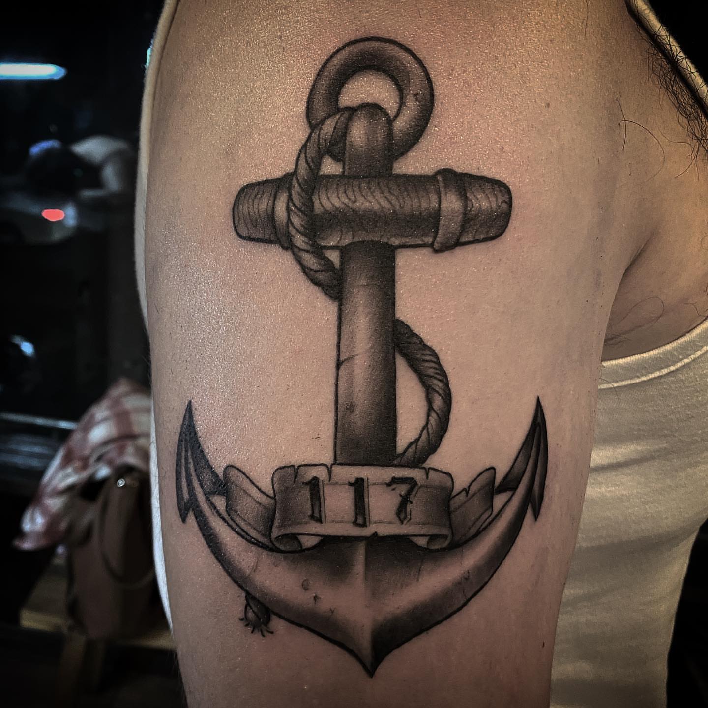 Anchor black and grey tattoo on the upper arm by ⠀⠀ ⠀ ⠀ ⠀⠀ ⠀⠀ ⠀⠀ ⠀ ⠀⠀ ⠀⠀ᎪᎳᏃ, West Hollywood, California