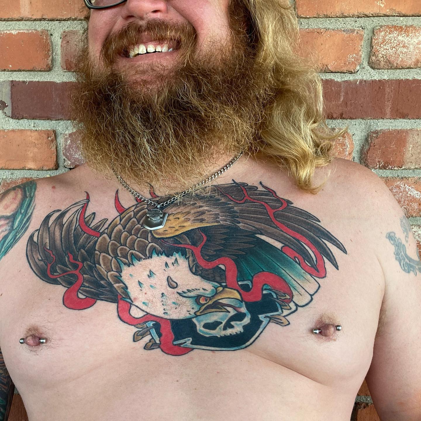 Eagle and skull American traditional tattoo on the chest by Chuck House