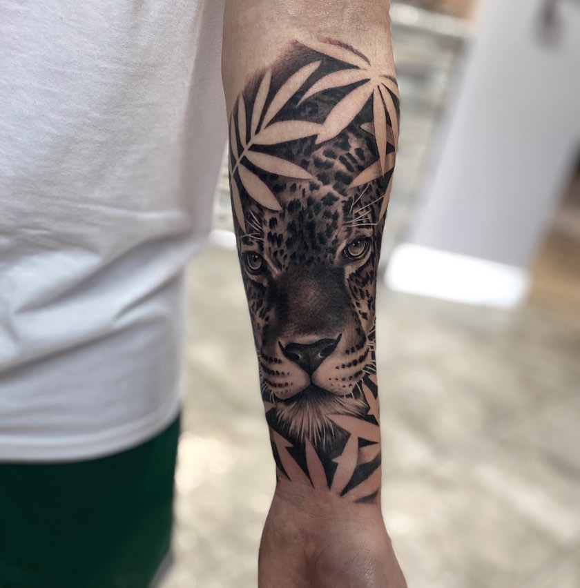 Leopard realism tattoo on the forearm by Aaron Carey, Salem, Oregon