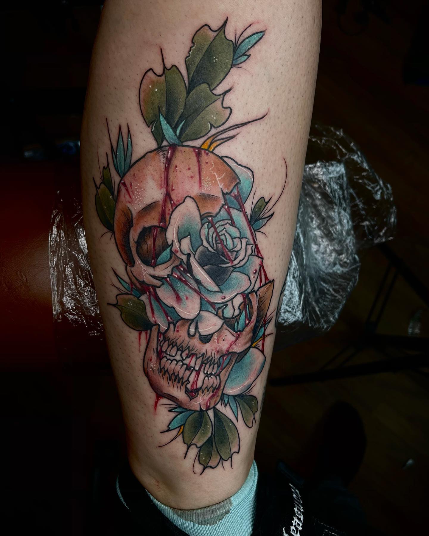 Skull and rose neo-traditional tattoo on the forearm by E