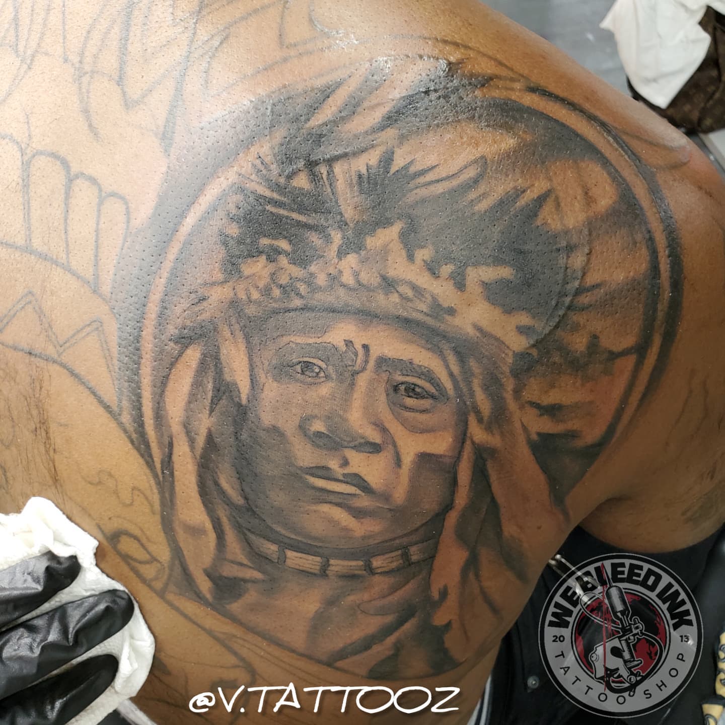 Indian chief realism tattoo on the shoulder by call (504)441-9275 for info
