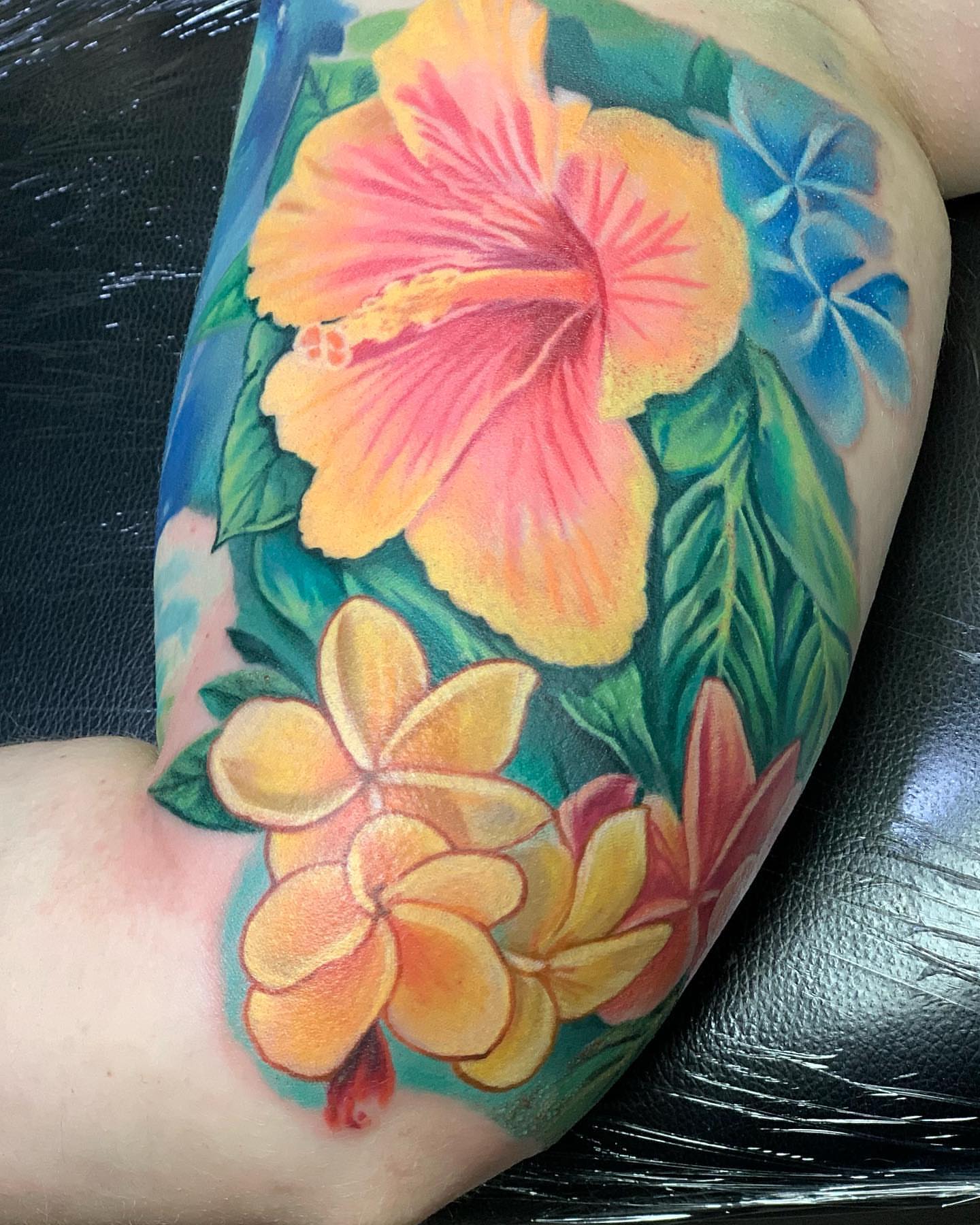 Floral bouquet realism tattoo on the forearm by TyEsha Reels