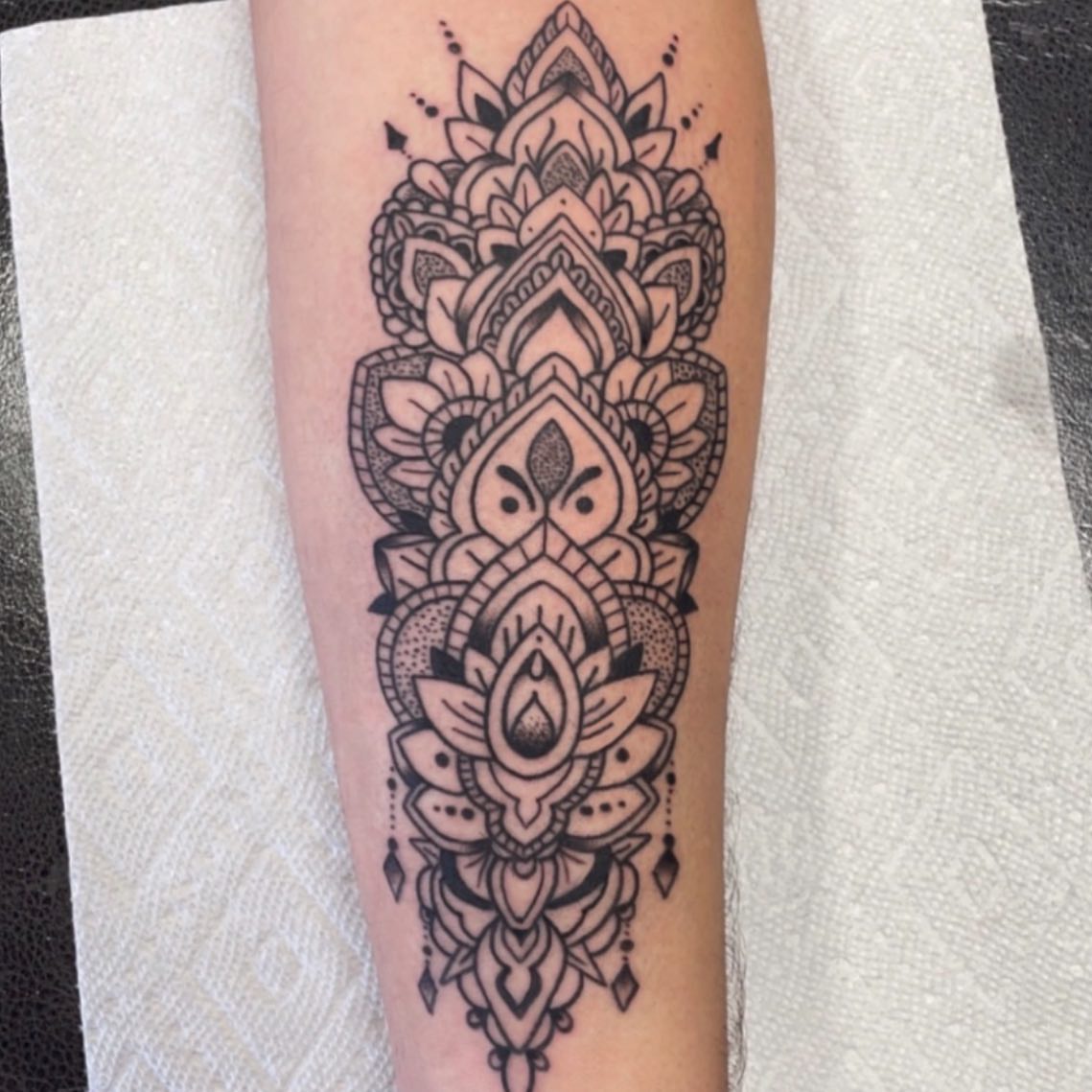 Lotus mandala geometric tattoo on the forearm by Danielle Dubois