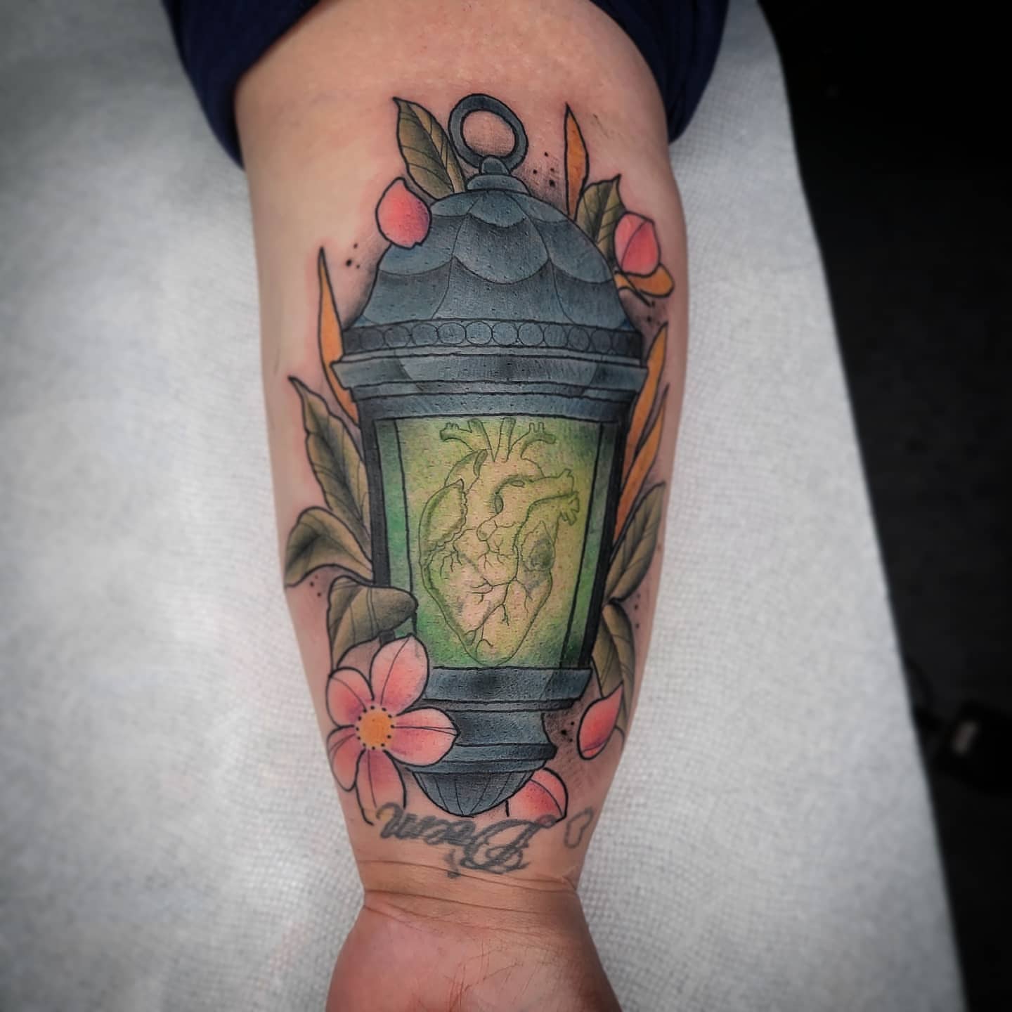 Heart lantern American traditional tattoo on the forearm by TattoosbyPhatboi