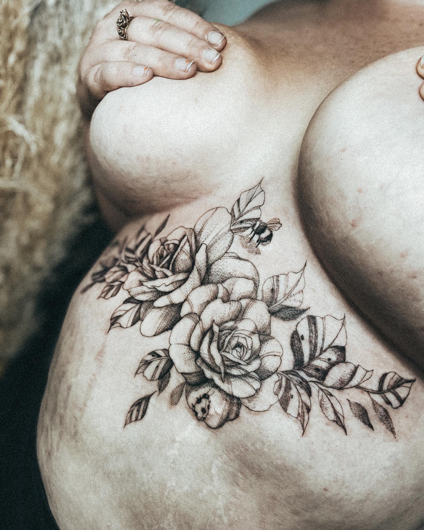 Floral bouquet dotwork tattoo on the thigh by Ayauna Mai