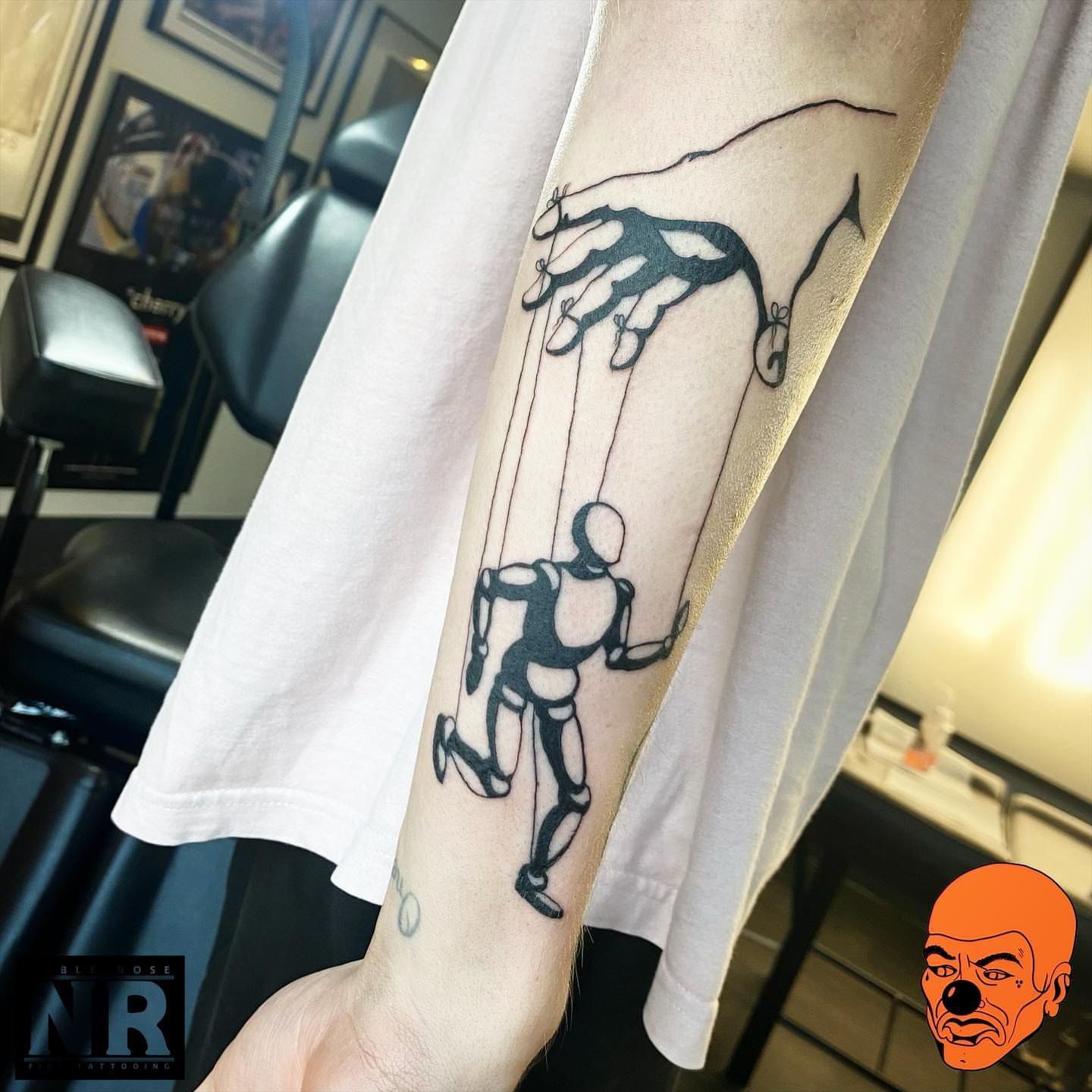 Puppet black and grey tattoo on the forearm by πππ πππππππ