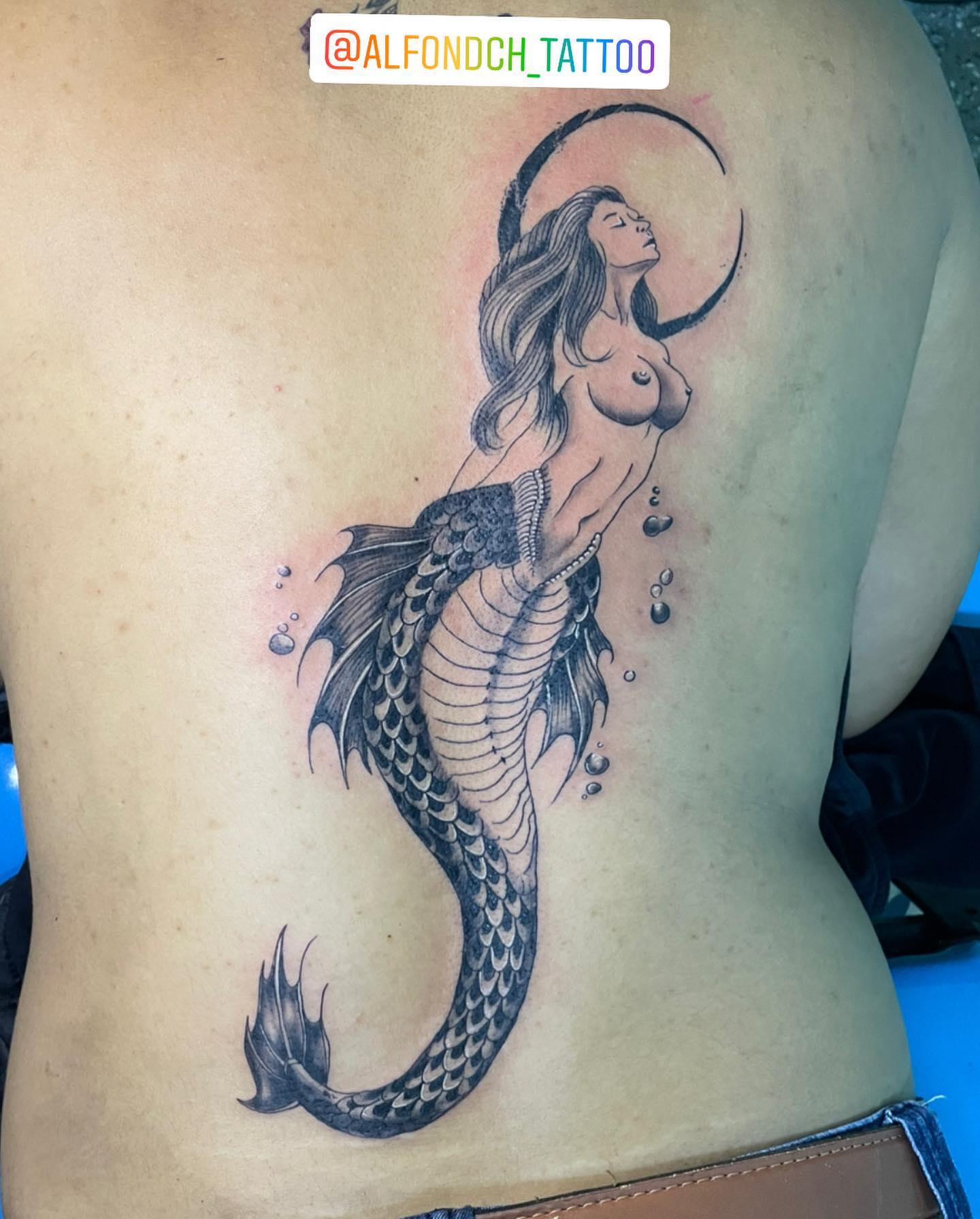 Mermaid black and grey tattoo on the back by Alfonso Duenas