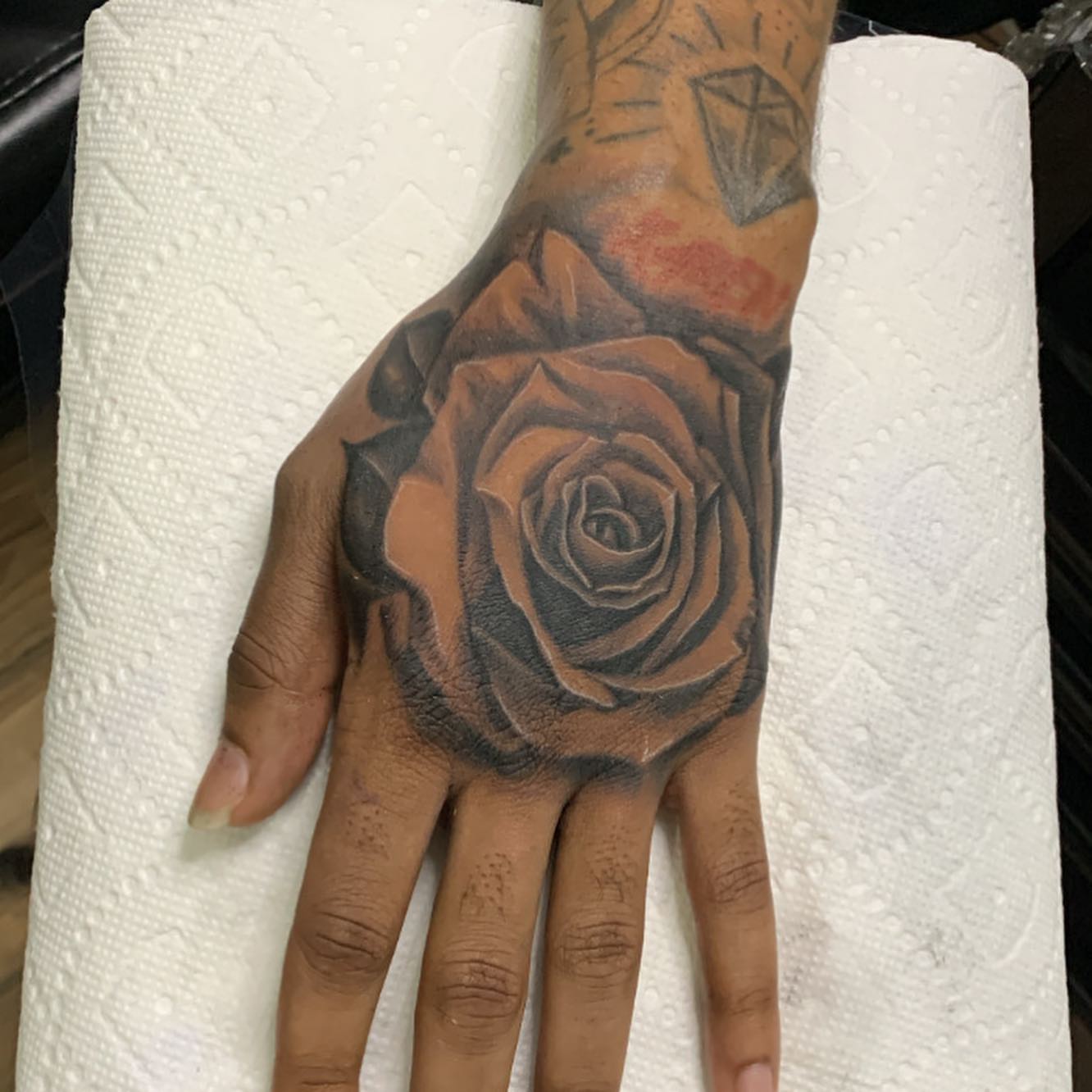 Rose realism tattoo on the hand by Lex⛓️