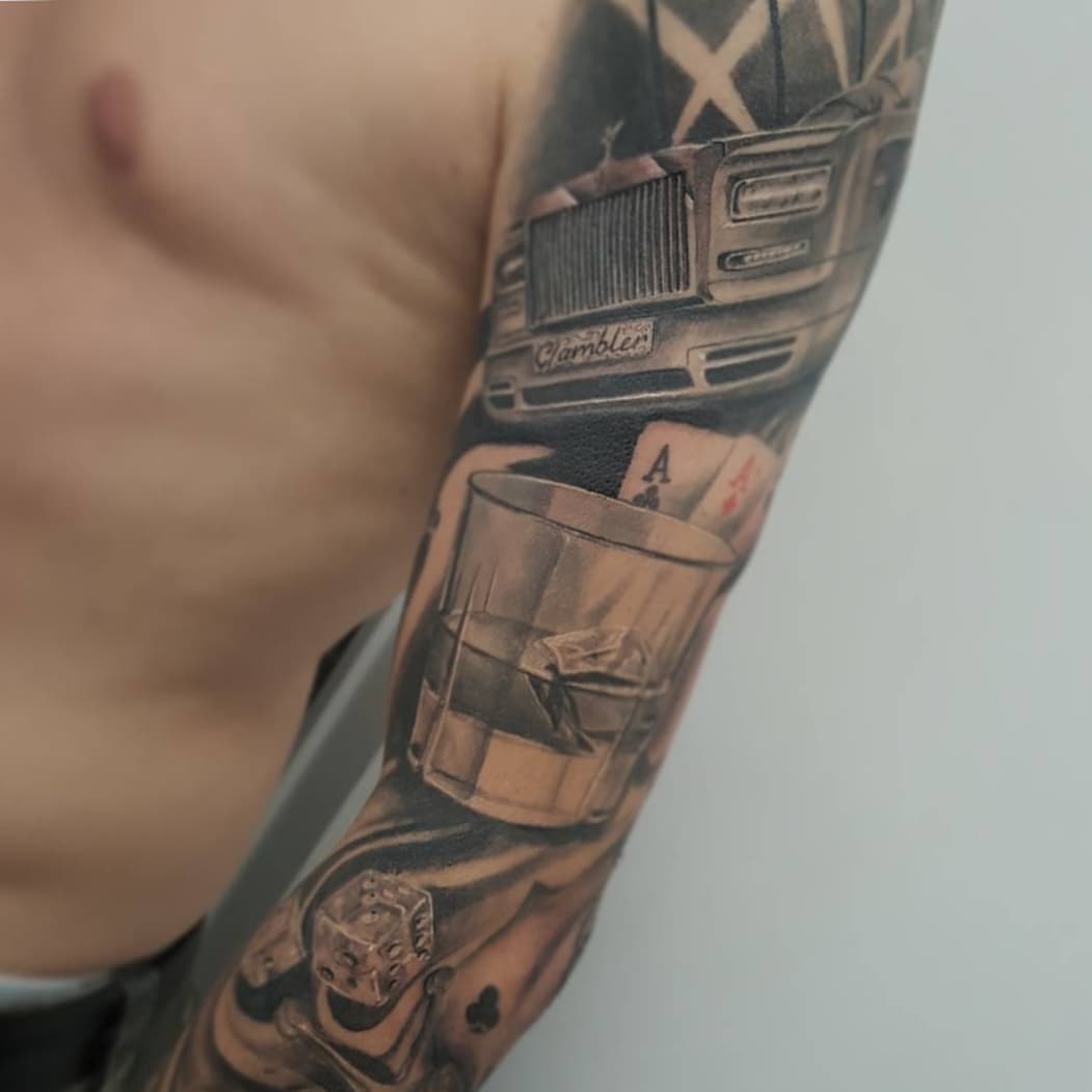 Truck and poker realism tattoo on the forearm by Pod Viñes
