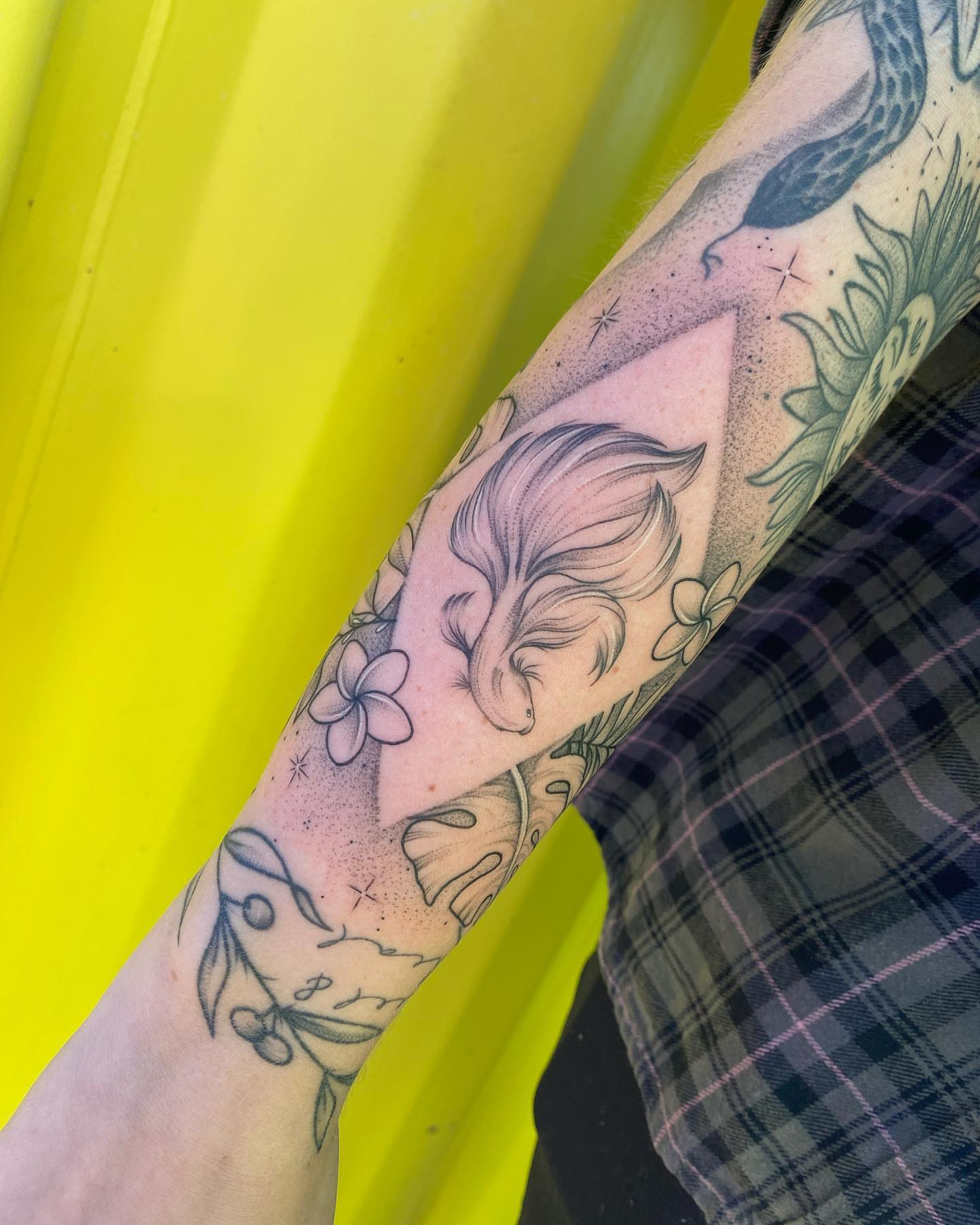 Koi fish and flowers dotwork tattoo on the forearm by ✨ Jaden Belle Tattoos ✨