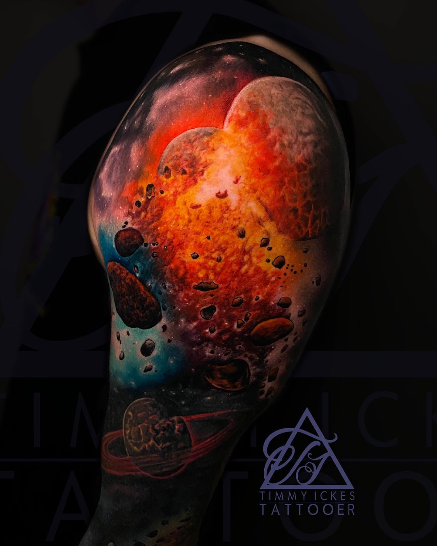 Galaxy realism tattoo on the upper arm by Timmy Ickes